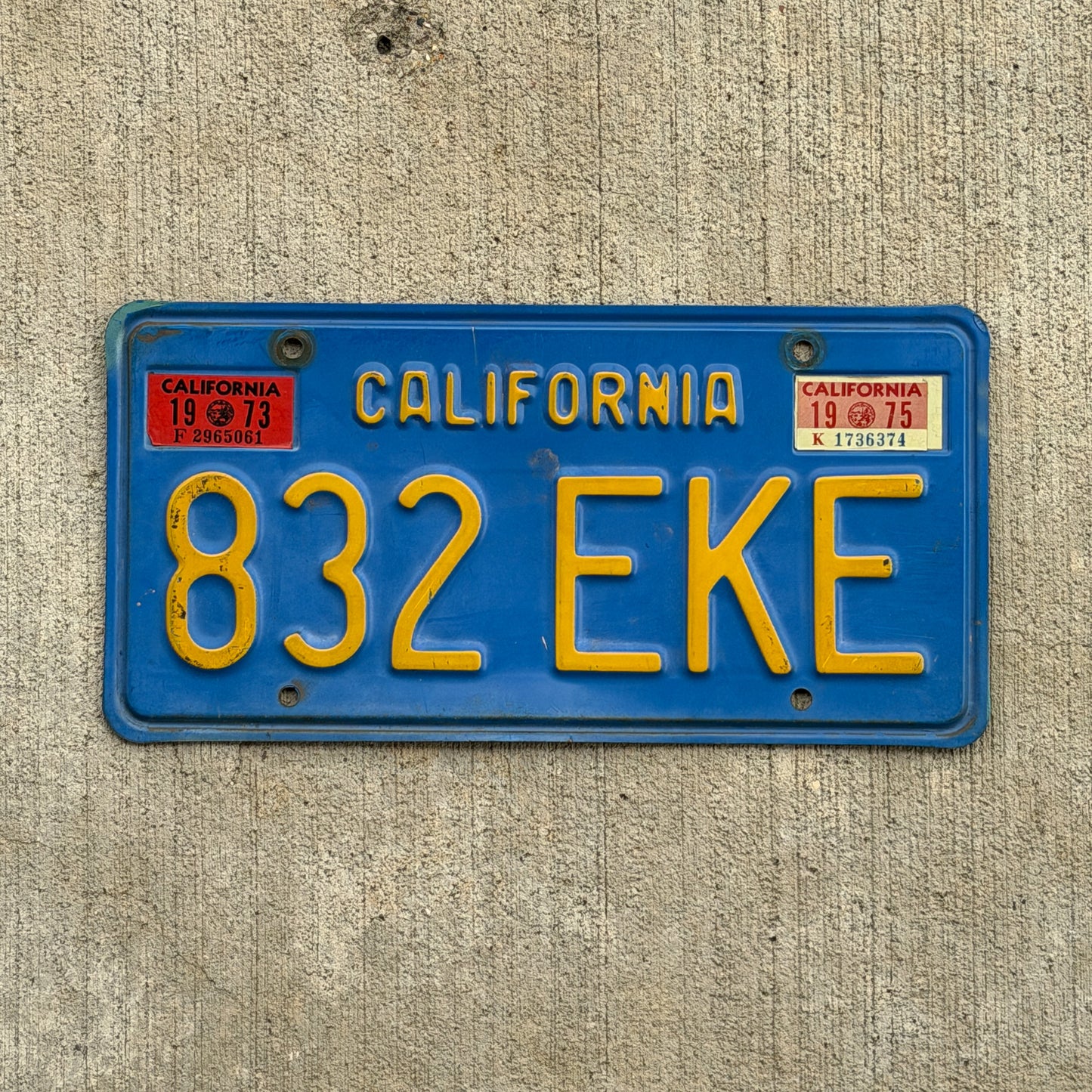 Photo of a 1970 1975 California License Plate Auto Tag Garage Decor Vintage 832 EKE with original patina