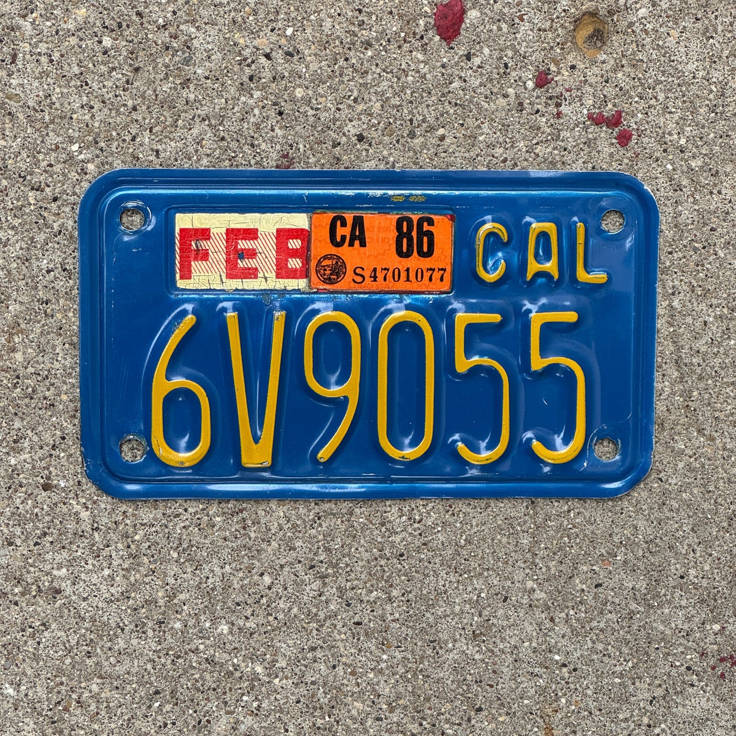 Photo of a 1970 1986 California Motorcycle License Plate Auto Tag Garage Decor Vintage 6V9055 with original patina