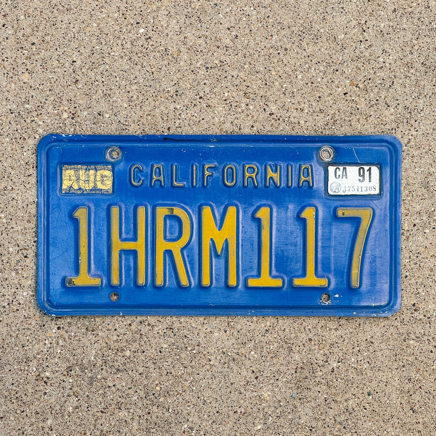 Photo of a 1970 1991 California License Plate Auto Tag Garage Decor Vintage 1 HRM 117 with original patina