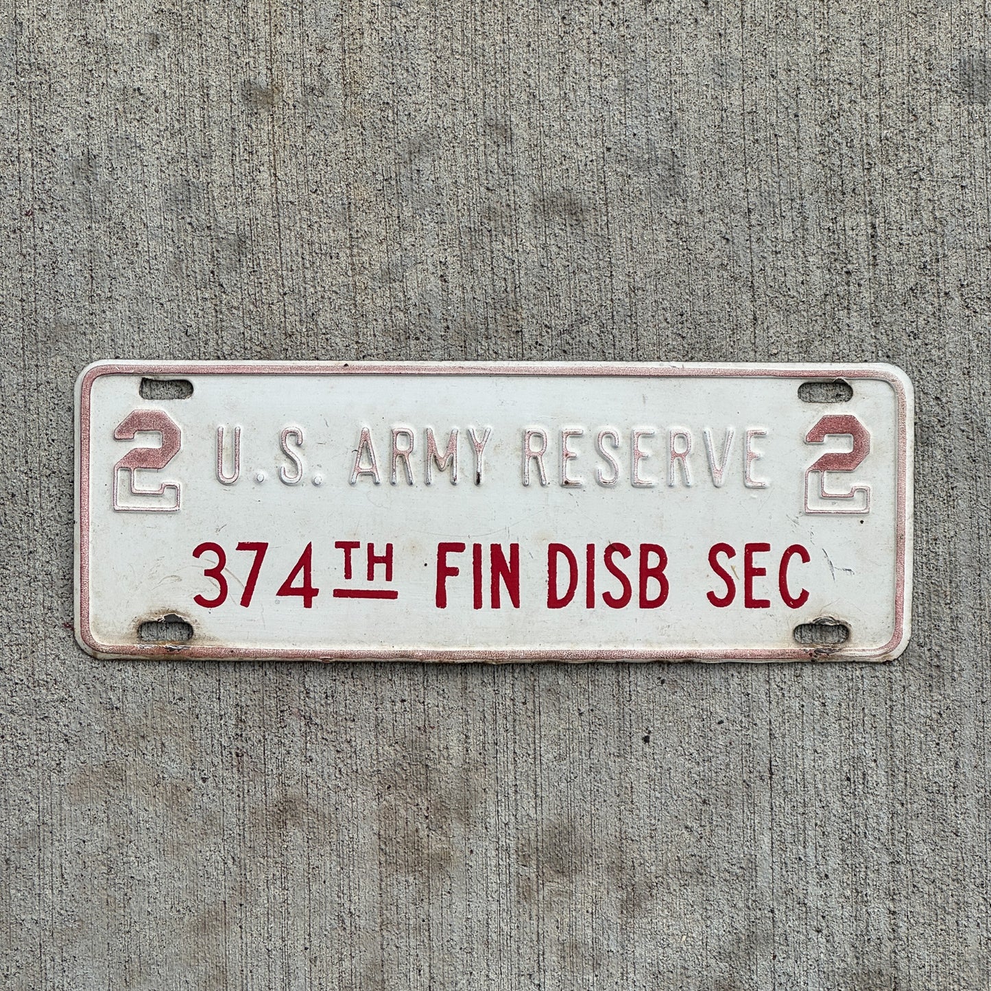 Photo of a 1970 Era 2 Army Reserve License Plate Topper Auto Tag Garage Decor Vintage 374th Fin Disb Sec Military with original patina