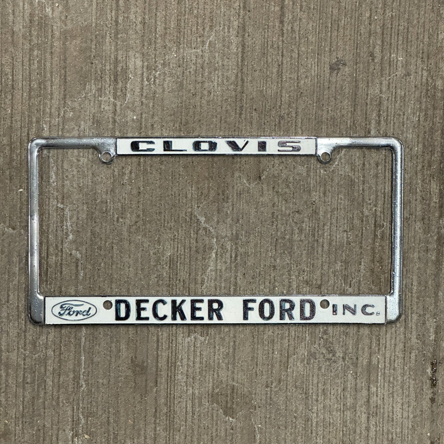 Photo of a 1970 Era California License Plate Frame Auto Tag Garage Decor Vintage Clovis Metal Metal Decker Ford with original patina