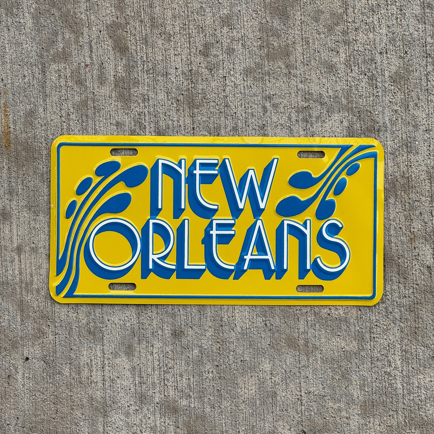 Photo of a 1970 Era New Orleans Louisiana Booster License Plate Auto Tag Garage Decor Vintage Metal with original patina