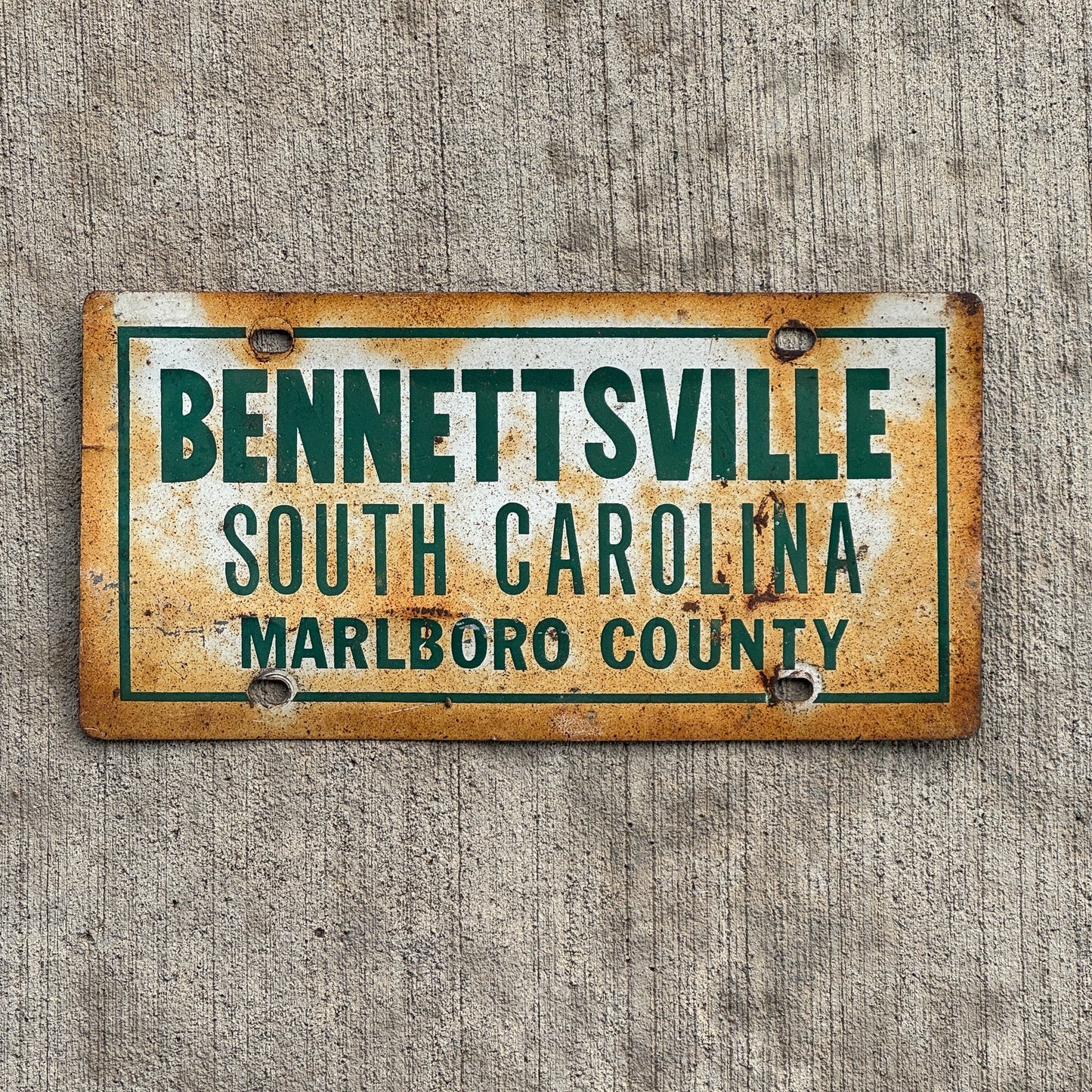 Photo of a 1970 Era South Carolina License Plate Booster License Plate Auto Tag Garage Decor Vintage Bennettsville South Carolina Marlboro County with original patina