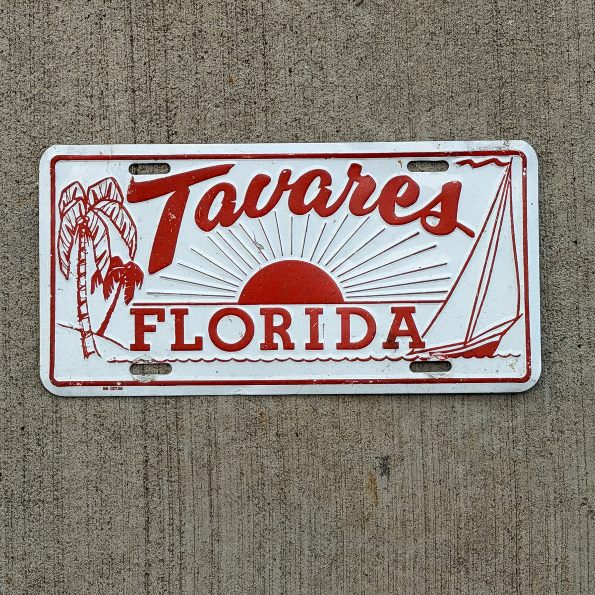 Photo of a 1970 Era Tavares Florida Booster License Plate Auto Tag Garage Decor Vintage
Beach Scene Sun Sailing Metal with original patina