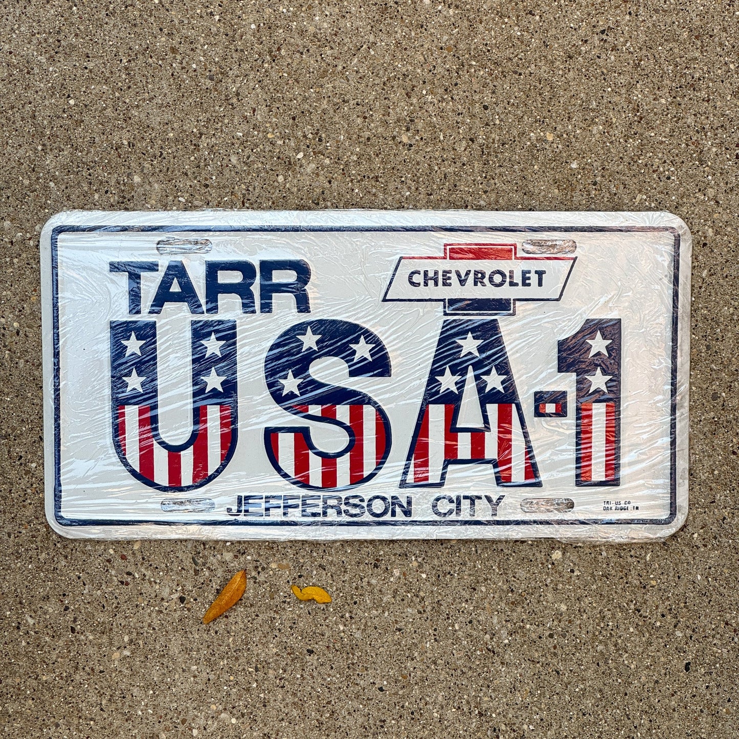 Photo of a 1970 Era Tennessee Booster License Plate Auto Tag Garage Decor Vintage Tarr Chevrolet Jeffreson City Metal USA 1 with original patina