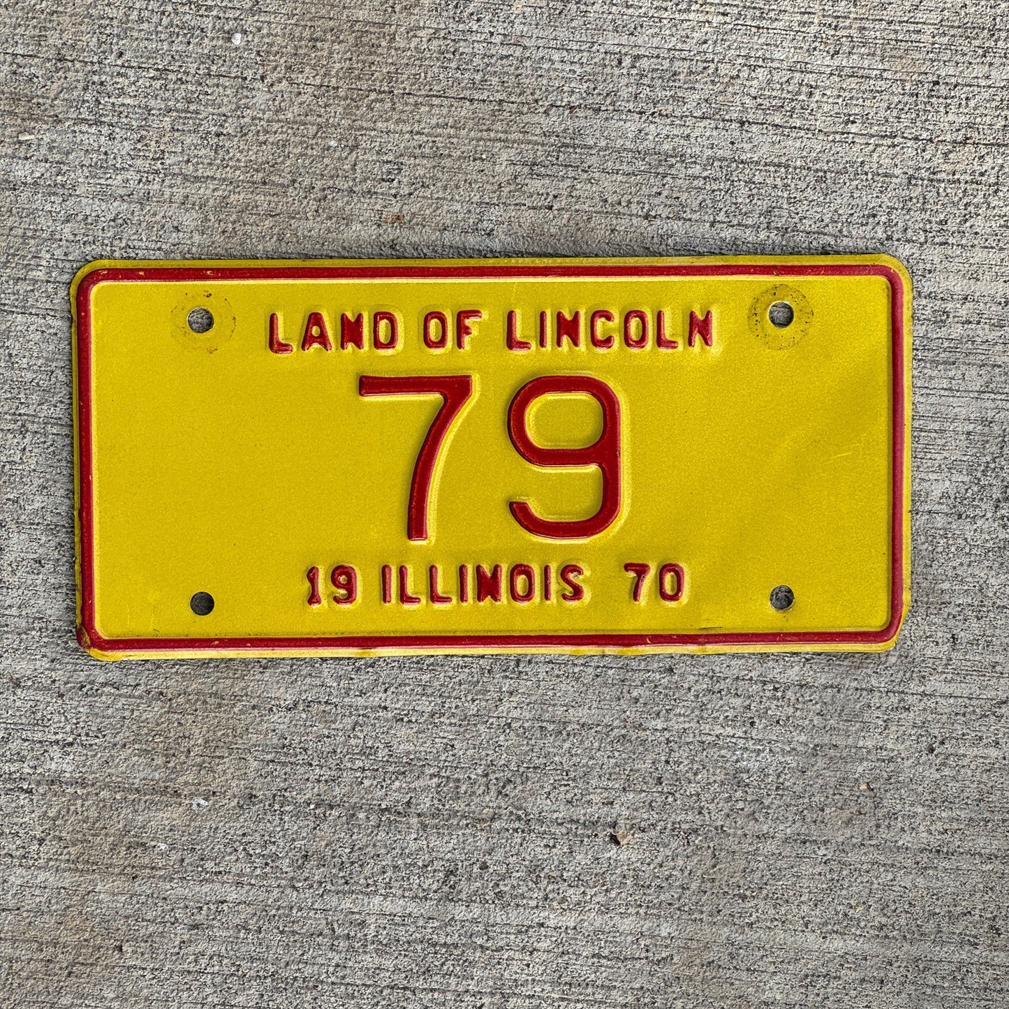 Photo of a 1970 Illinois Motorcycle License Plate Auto Tag Garage Decor Vintage Low Number Two Digit 79 with original patina