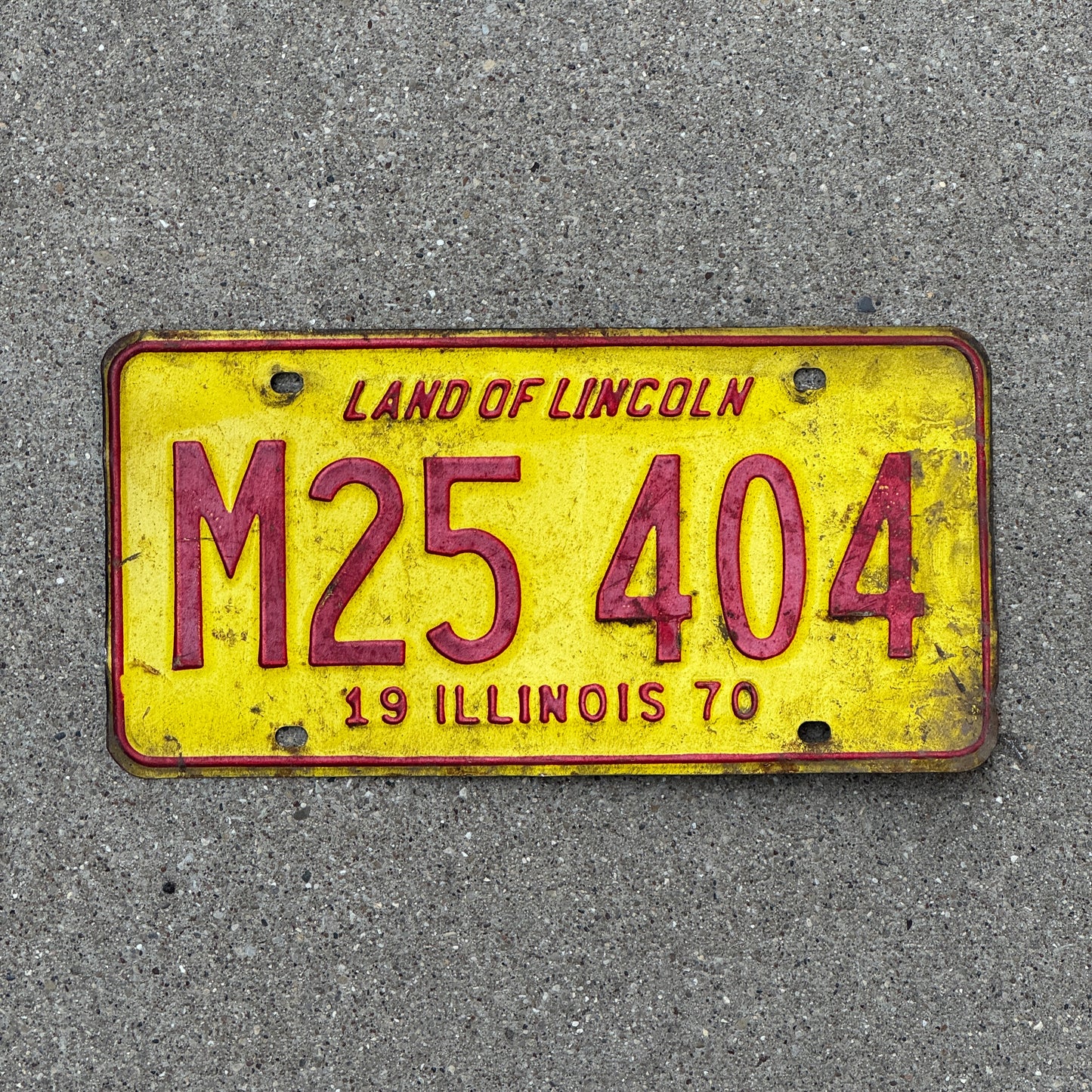 Photo of a 1970 Illinois Municipal License Plate Auto Tag 2 Vintage Garage M 25 404 with original patina