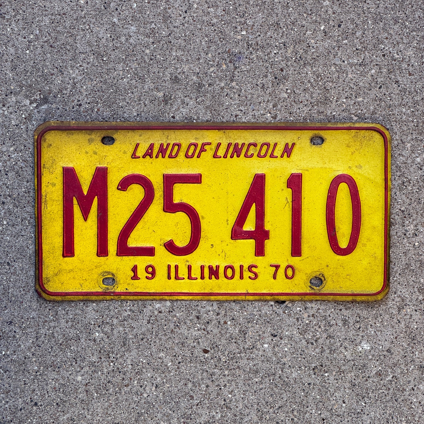 Photo of a 1970 Illinois Municipal License Plate Auto Tag 2 Vintage Garage M 25 410 with original patina