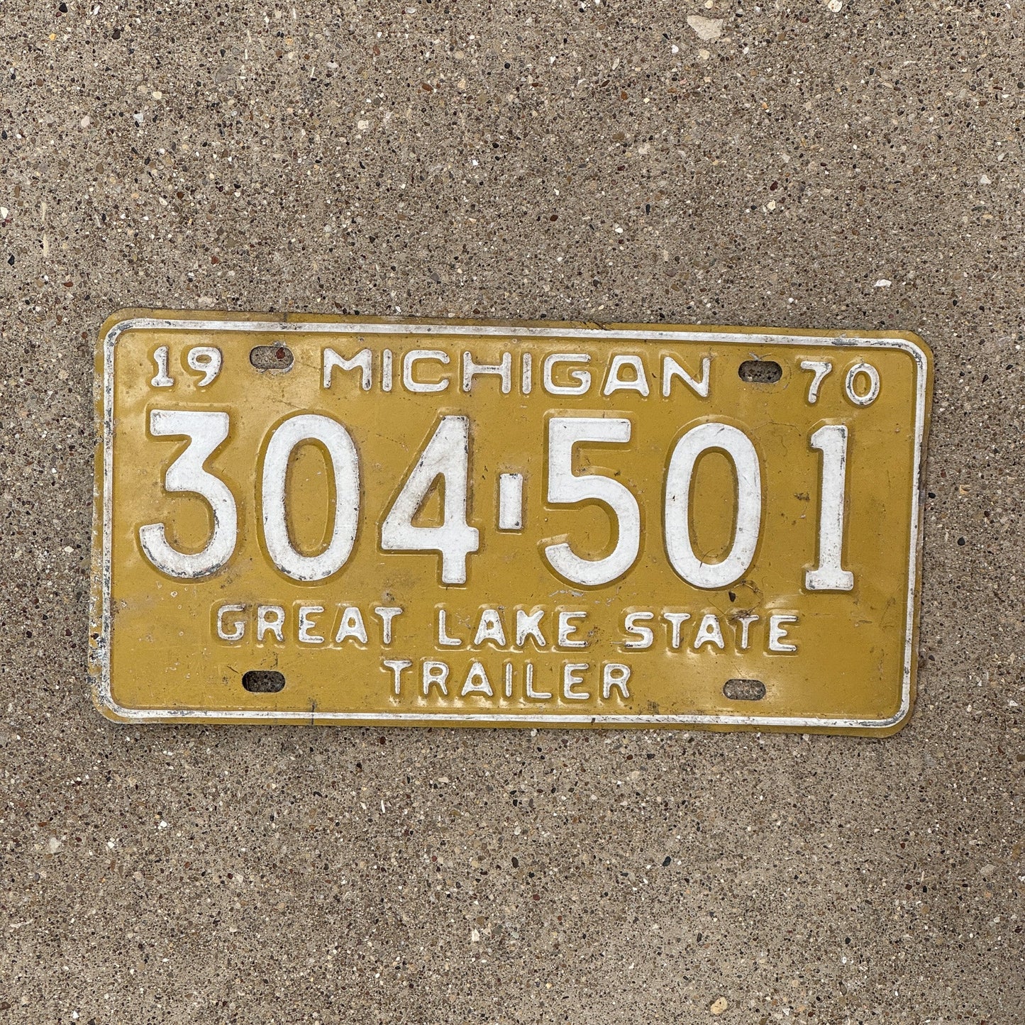 Photo of a 1970 Michigan License Plate Auto Tag Garage Decor Vintage 304 501