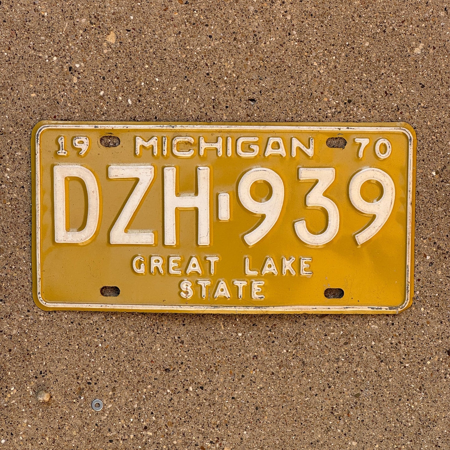 Photo of a 1970 Michigan License Plate Auto Tag Garage Decor Vintage DZH 939