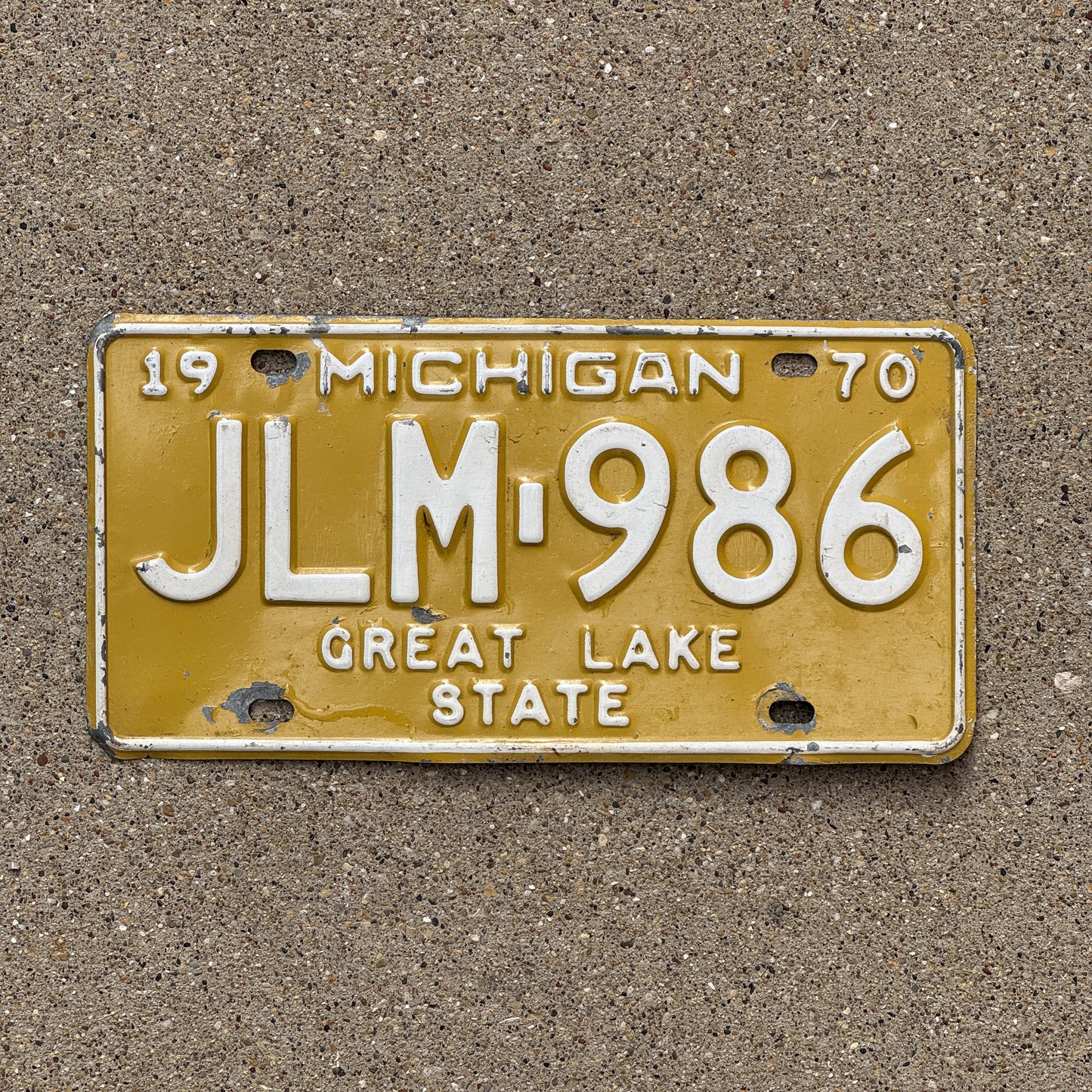 Photo of a 1970 Michigan License Plate Auto Tag Garage Decor Vintage JLM 986 with original patina