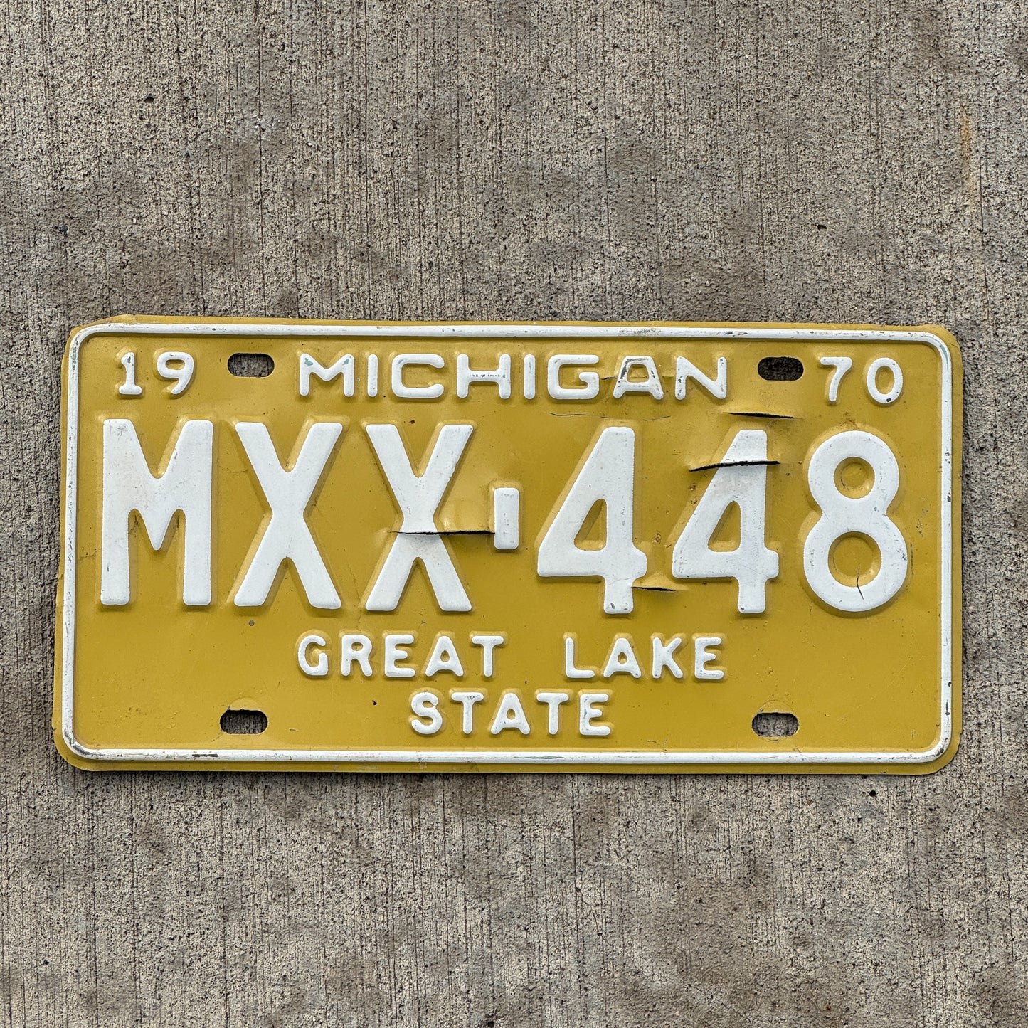 Photo of a 1970 Michigan License Plate Auto Tag Garage Decor Vintage MXX 448 with original patina