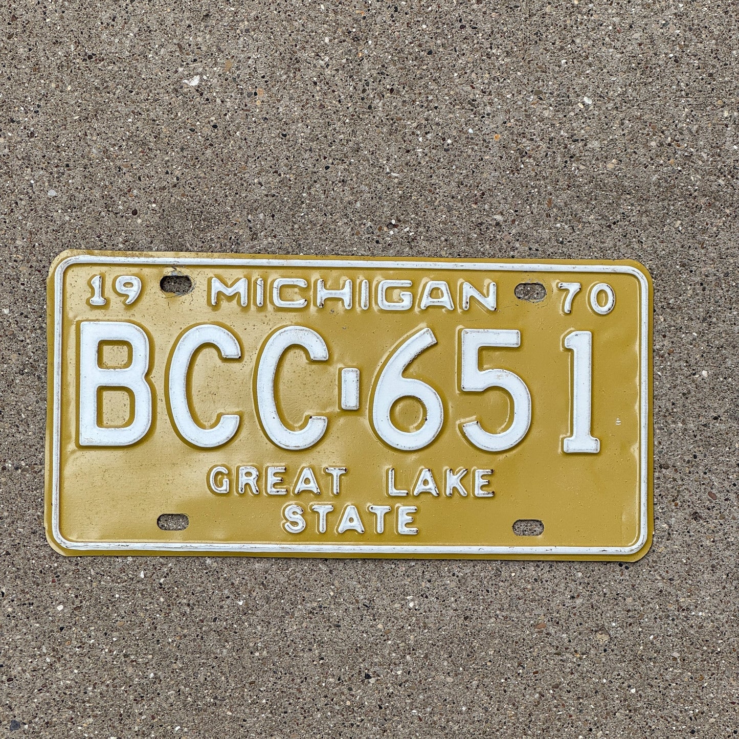 Photo of a 1970 Michigan License Plate Auto Tag Garage Decor Vintage Yellow BCC 651