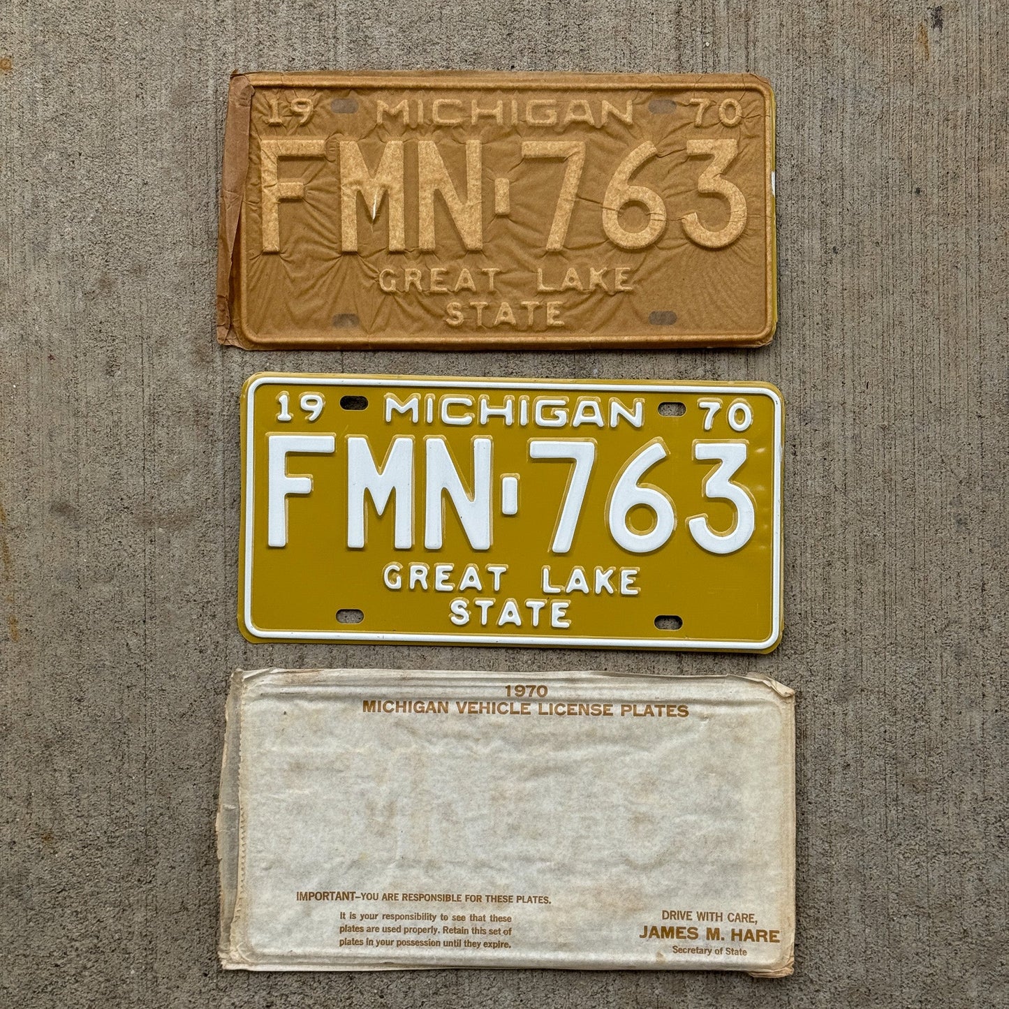 Photo of a 1970 Michigan License Plate Pair Auto Tag Garage Decor Vintage NOS with Original Mailing Envelope FMN 763