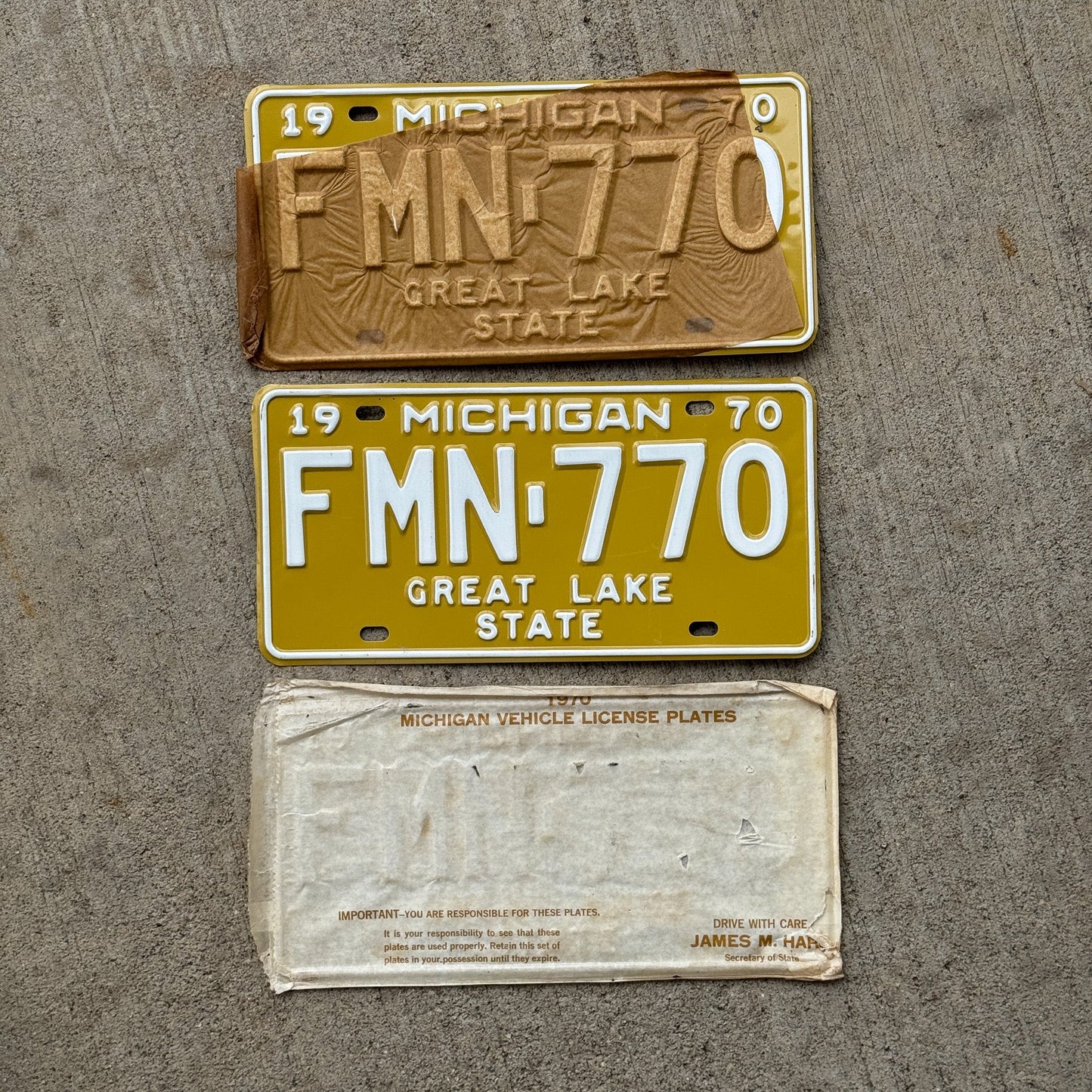 Photo of a 1970 Michigan License Plate Pair Auto Tag Garage Decor Vintage NOS with Original Mailing Envelope FMN 770