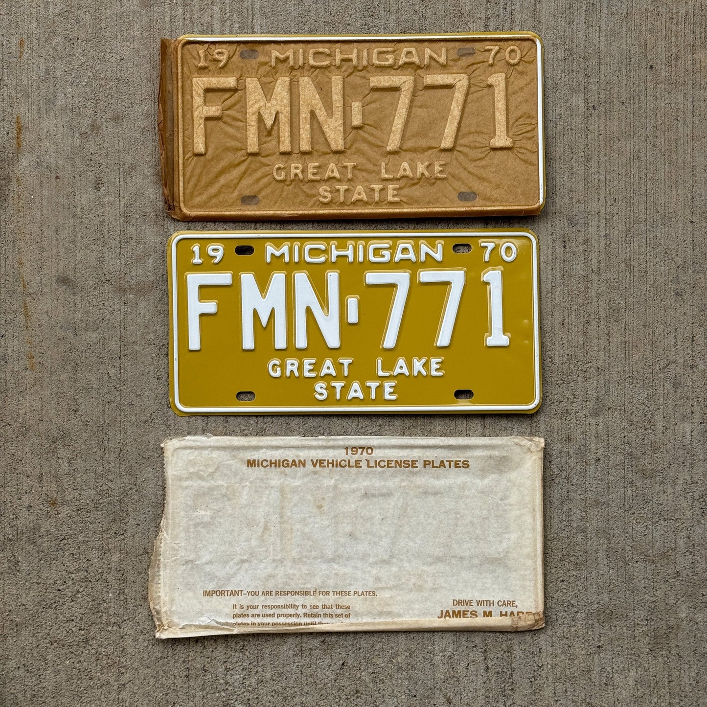 Photo of a 1970 Michigan License Plate Pair Auto Tag Garage Decor Vintage NOS with Original Mailing Envelope FMN 771