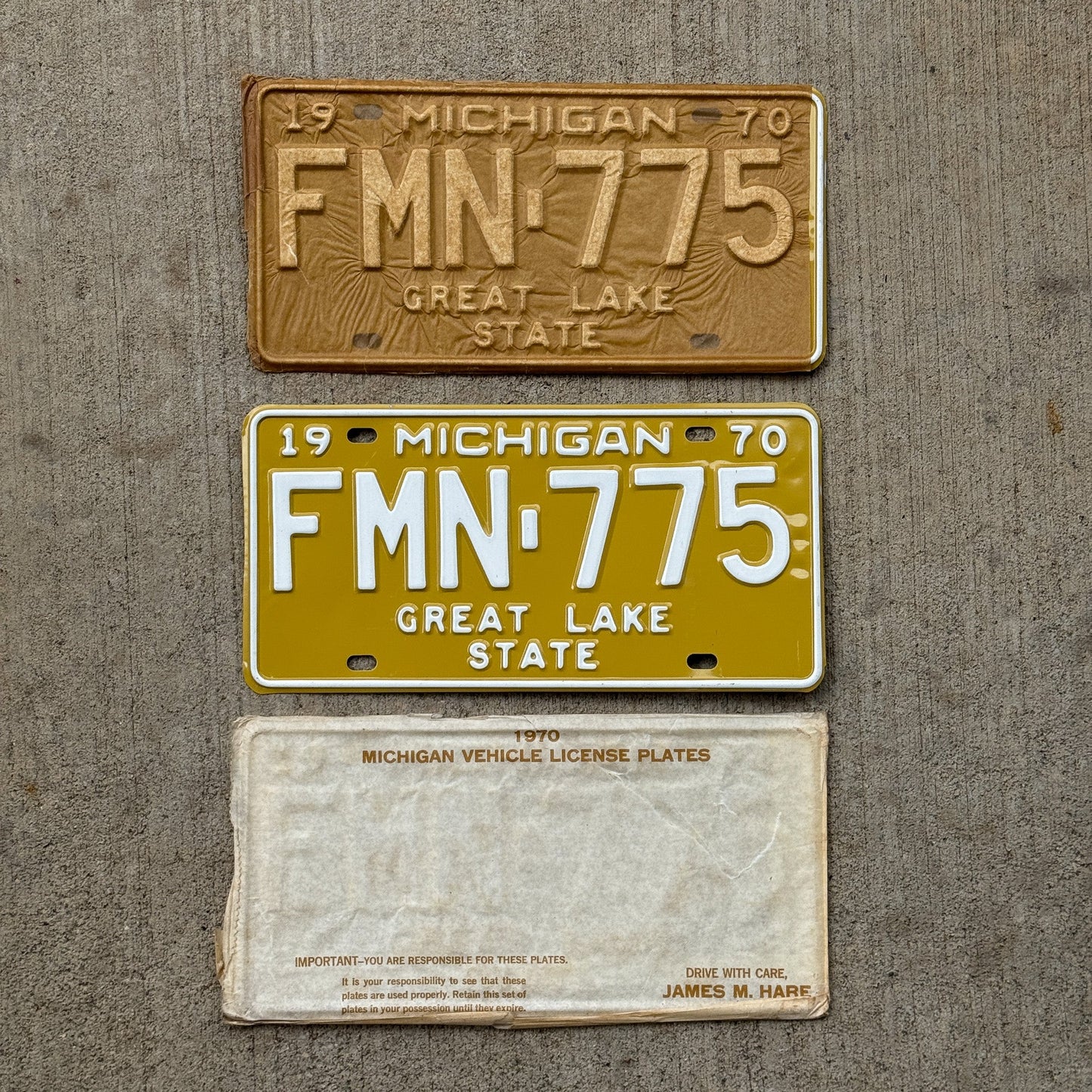 Photo of a 1970 Michigan License Plate Pair Auto Tag Garage Decor Vintage NOS with Original Mailing Envelope FMN 775