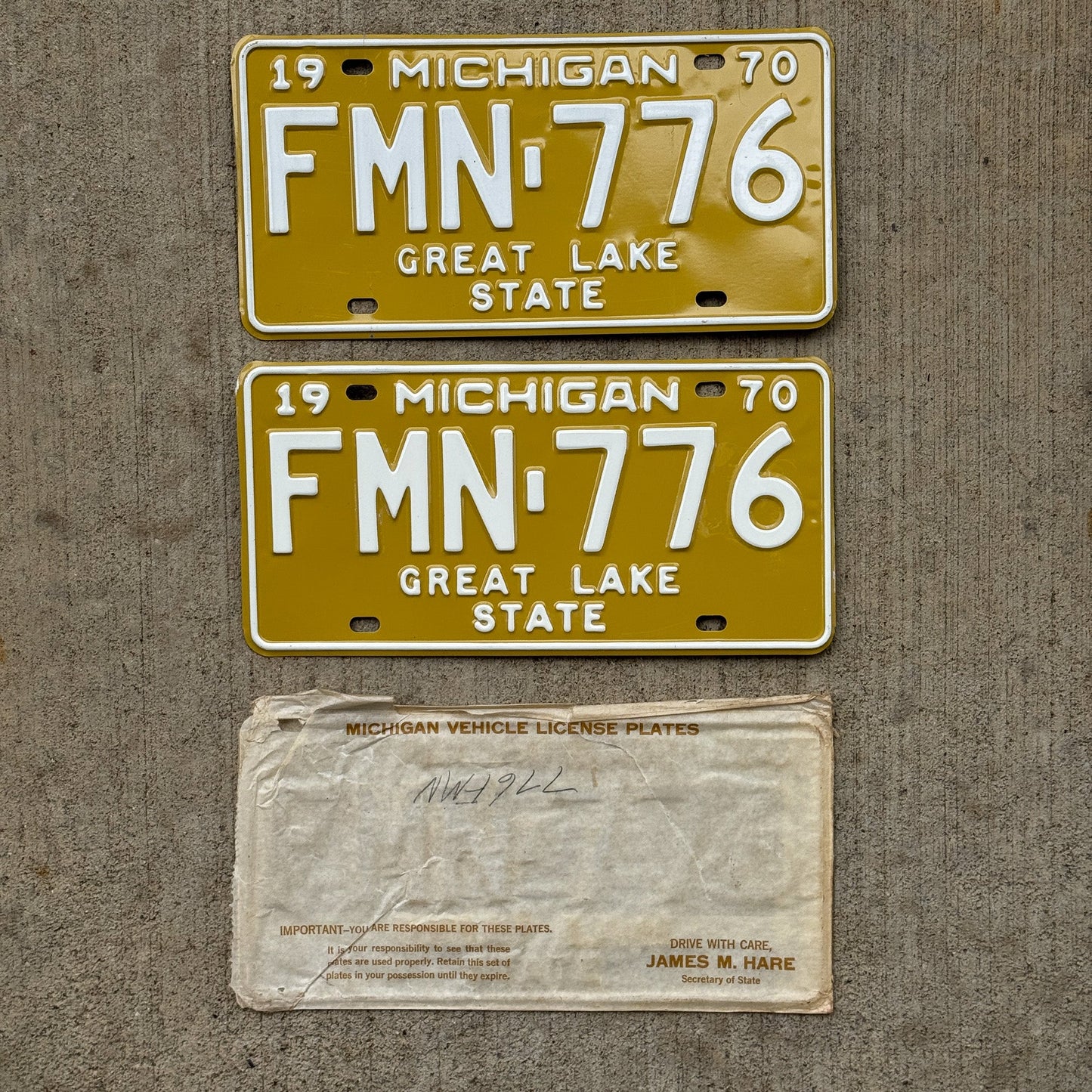 Photo of a 1970 Michigan License Plate Pair Auto Tag Garage Decor Vintage NOS with Original Mailing Envelope FMN 776