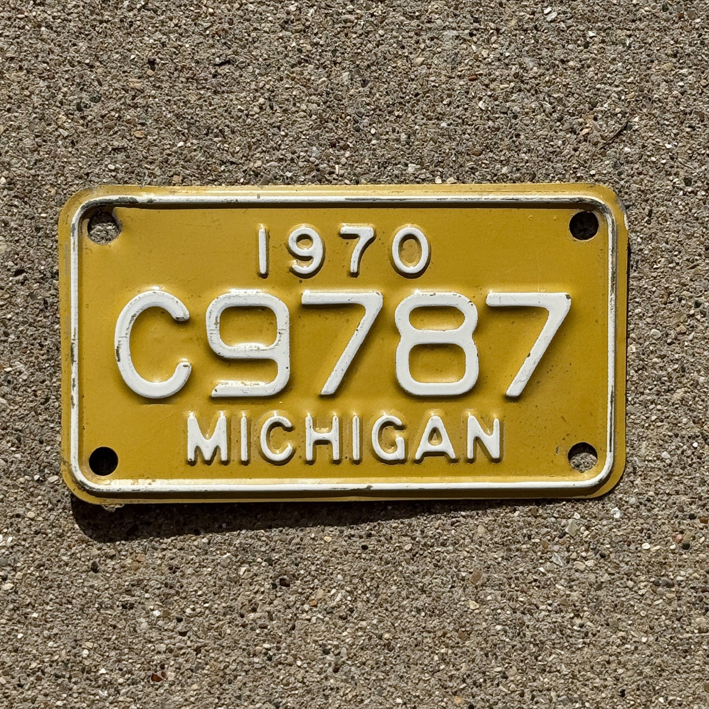 Photo of a 1970 Michigan Motorcycle License Plate Auto Tag Garage Decor Vintage C 9787
