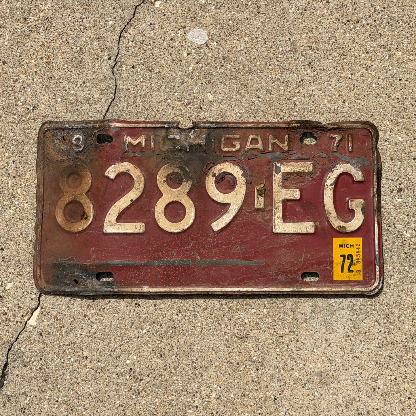 Photo of a 1971 1972 Michigan Commercial License Plate Auto Tag Garage Decor Vintage 8289 EG with original patina