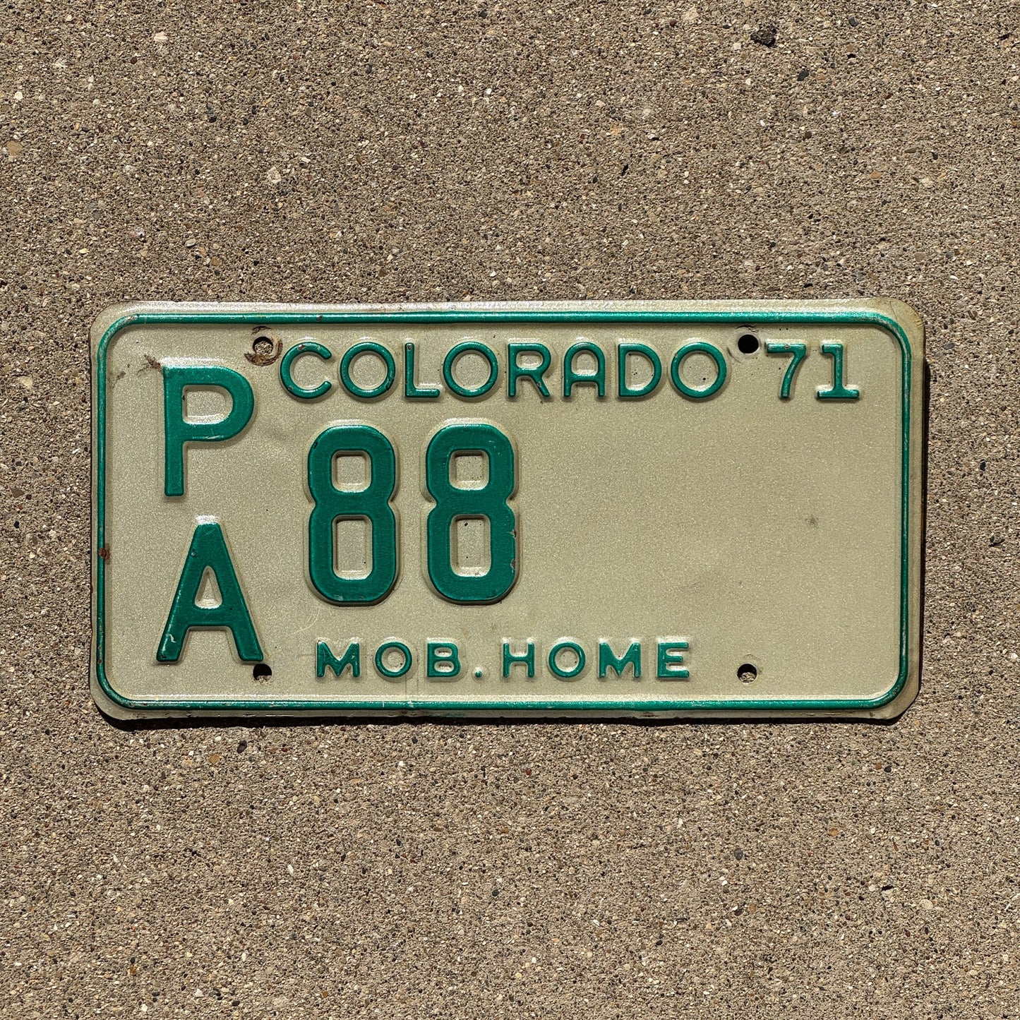 Photo of a 1971 Colorado Mobile Home License Plate Auto Tag Garage Decor Vintage PA 88