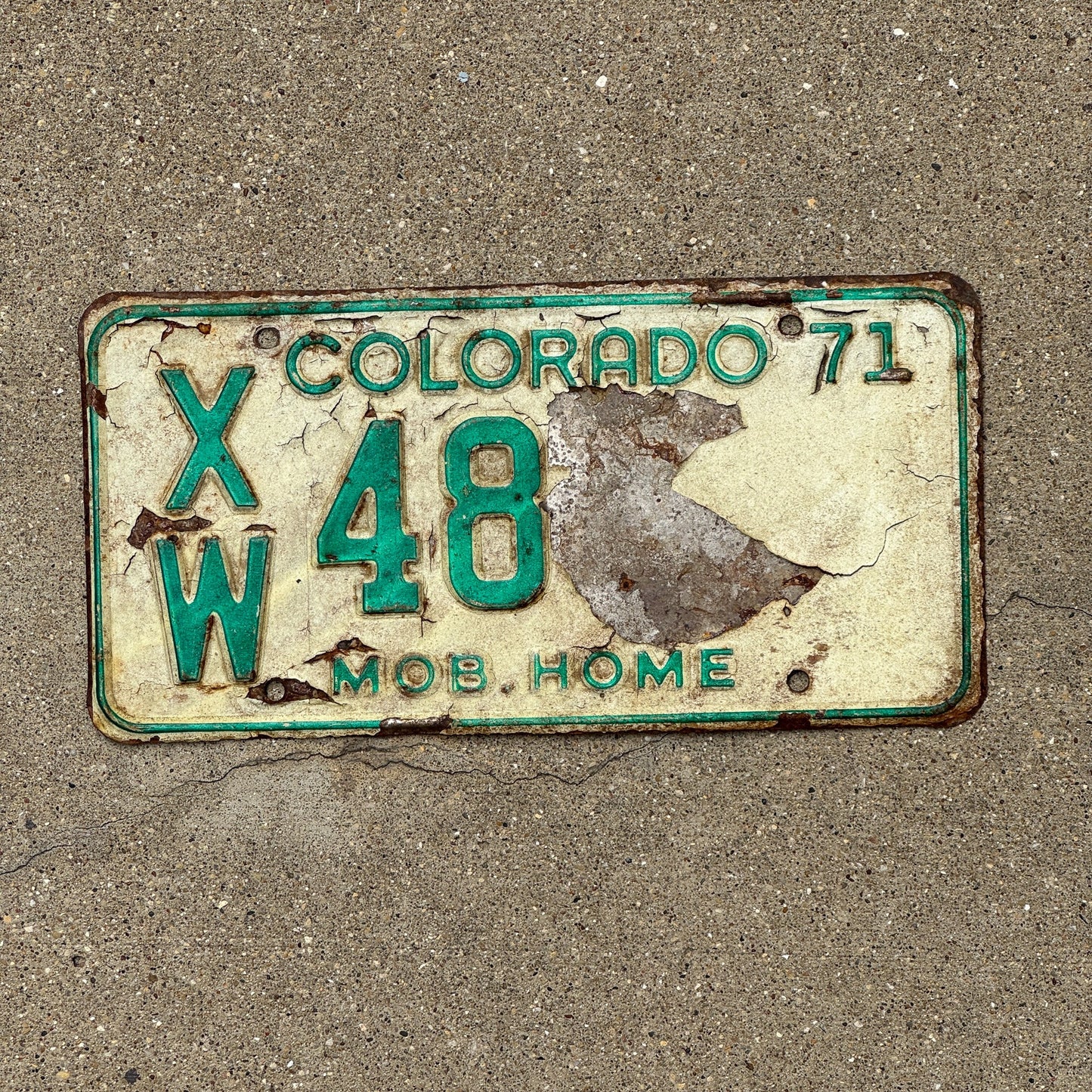 Photo of a 1971 Colorado Mobile Home License Plate Auto Tag Garage Decor Vintage XW 48