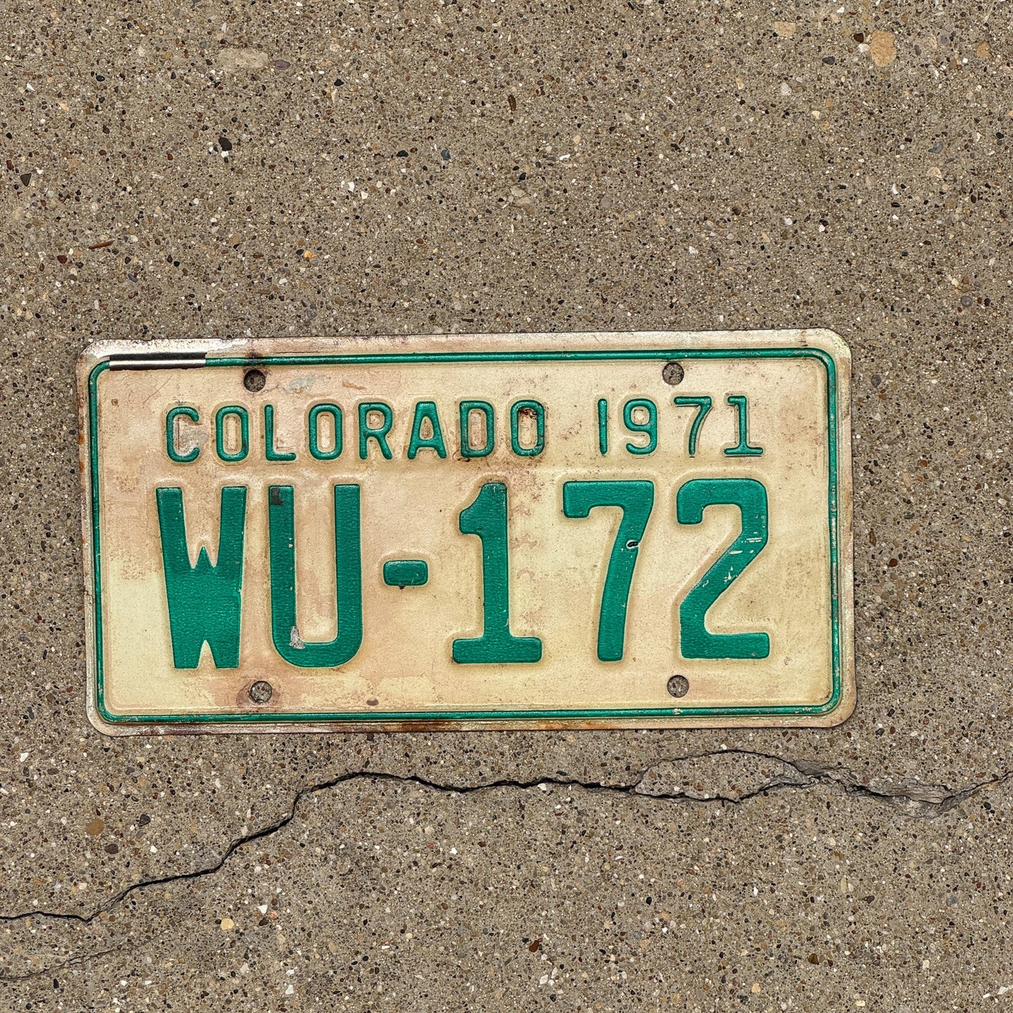 Photo of a 1971 Colorado Motorcycle License Plate Auto Tag Garage Decor Vintage WU 172