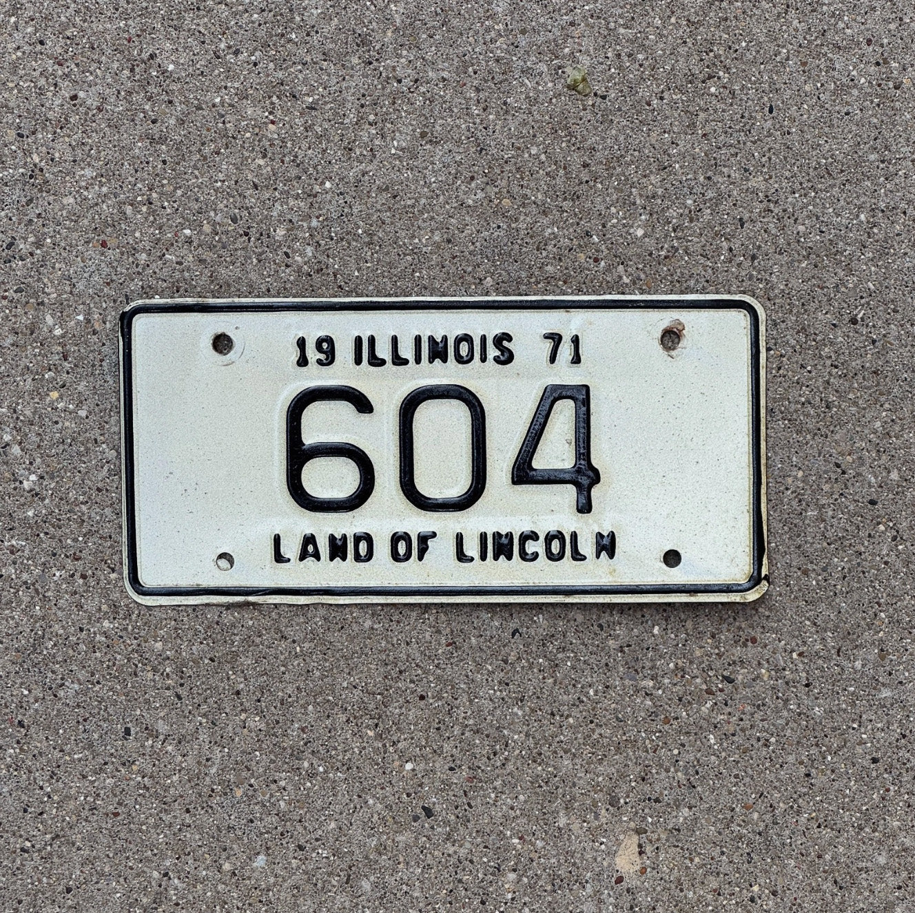Photo of a 1971 Illinois Motorcycle License Plate Auto Tag Garage Decor Vintage Low Number Three Digit 604 with original patina