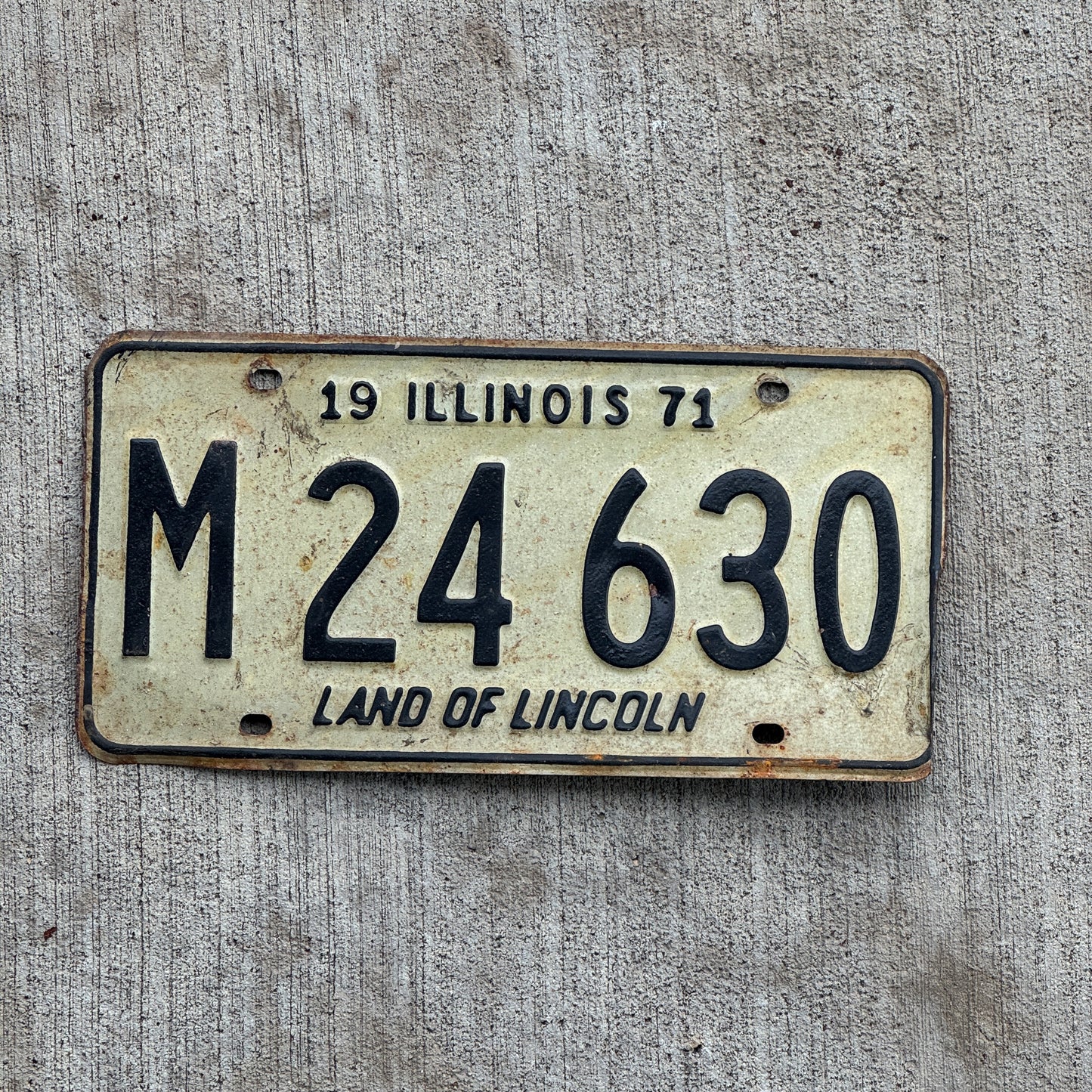 Photo of a 1971 Illinois Municipal License Plate Auto Tag 1 Vintage Garage M 24 630 with original patina