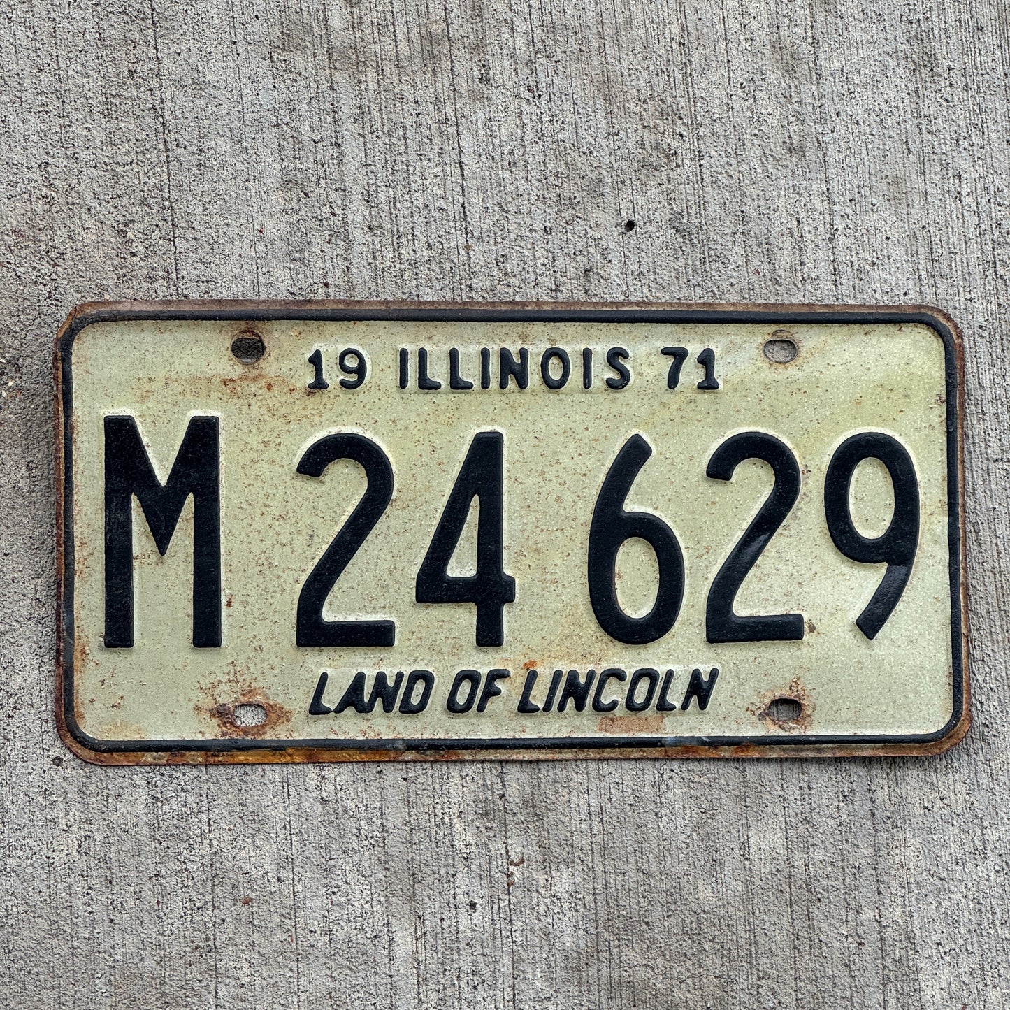 Photo of a 1971 Illinois Municipal License Plate Auto Tag 2 Vintage Garage M 24 629 with original patina