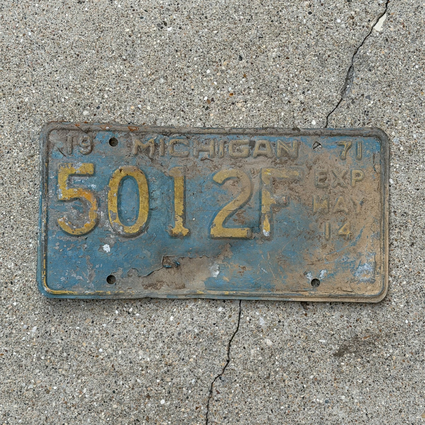 Photo of a 1971 Michigan Commercial License Plate Auto Tag Garage Decor Vintage Half Year 501 2F with original patina