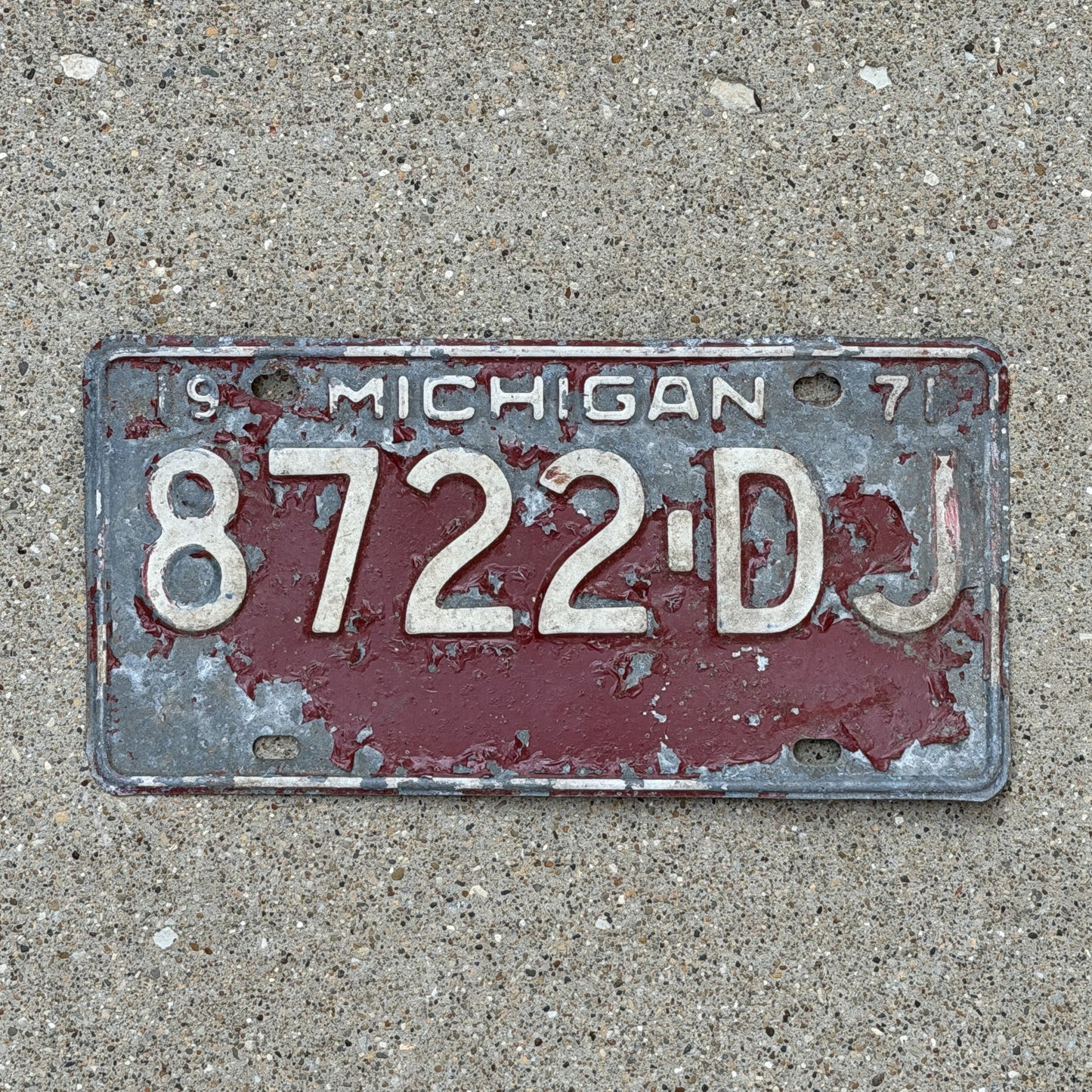 Photo of a 1971 Michigan Commercial License Plate Auto Tag Garage Decor Vintage Heavy Commercial 8722 DJ with original patina