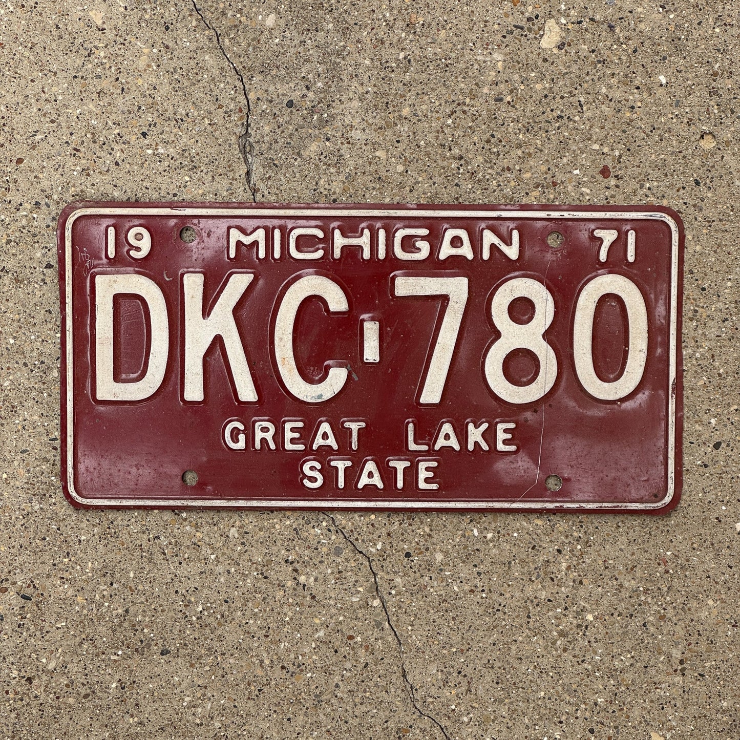 Photo of a 1971 Michigan License Plate Auto Tag Garage Decor Vintage DKC 780