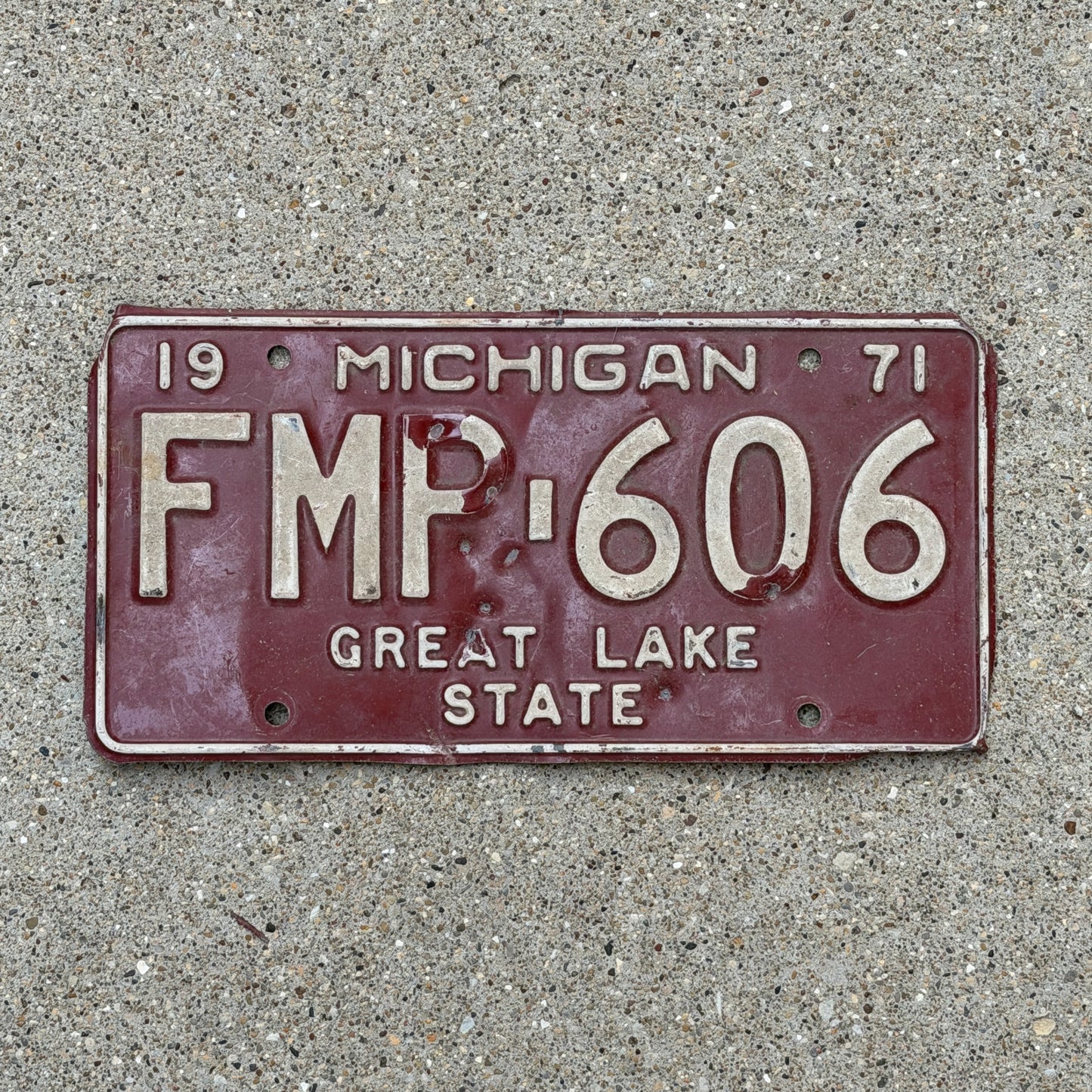 Photo of a 1971 Michigan License Plate Auto Tag Garage Decor Vintage FMP 606 with original patina