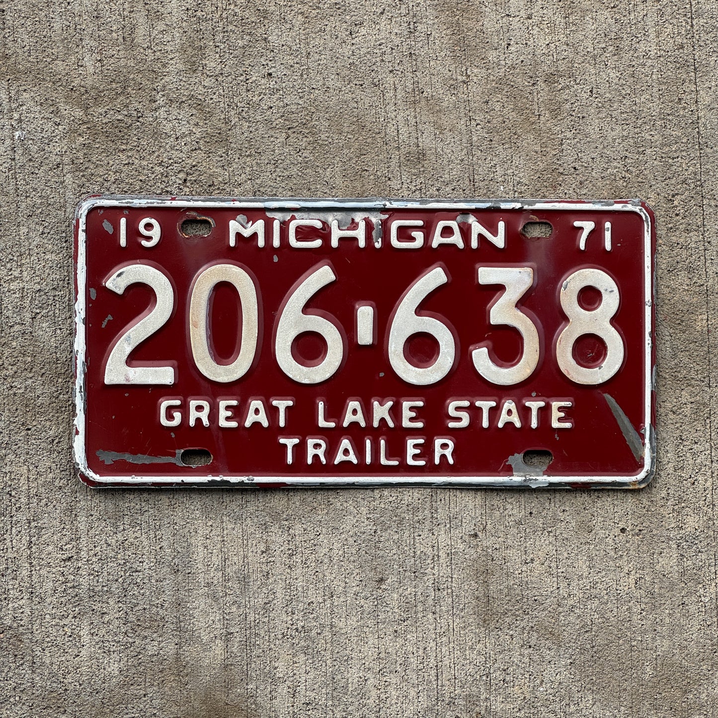 Photo of a 1971 Michigan Trailer License Plate Auto Tag Garage Decor Vintage 206 638 with original patina