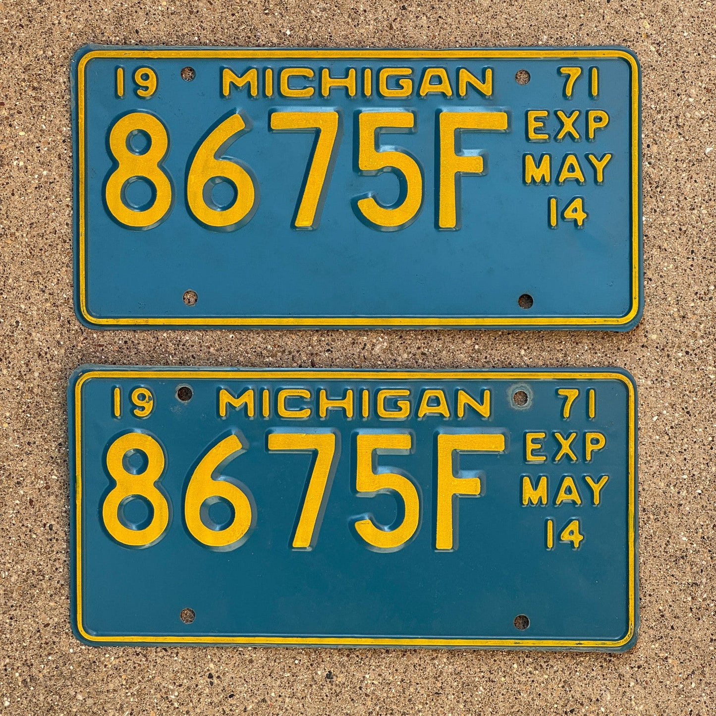 Photo of a 1971 Michigan Truck Half Year License Plate Pair Auto Tag Garage Decor Vintage May 8675 F