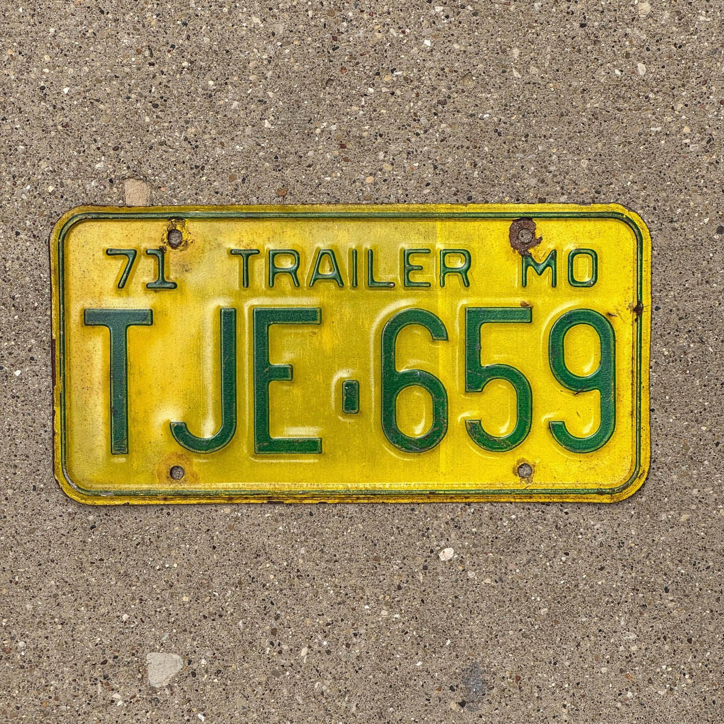 Photo of a 1971 Missouri Trailer License Plate Auto Tag Garage Decor Vintage TJE 659