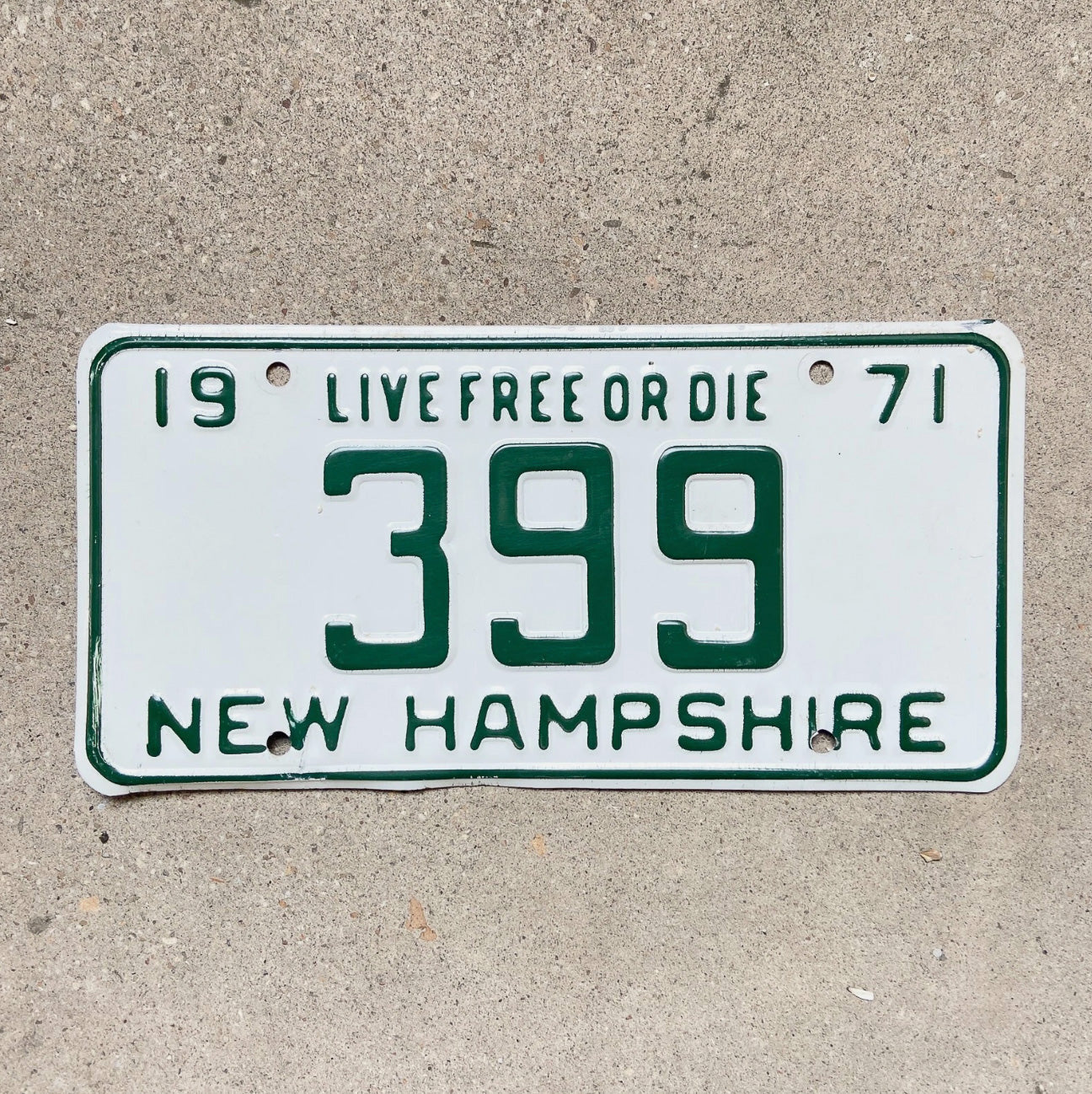 Photo of a 1971 New Hampshire License Plate Auto Tag Garage Decor Vintage Low Number Three Digit 399 with original patina