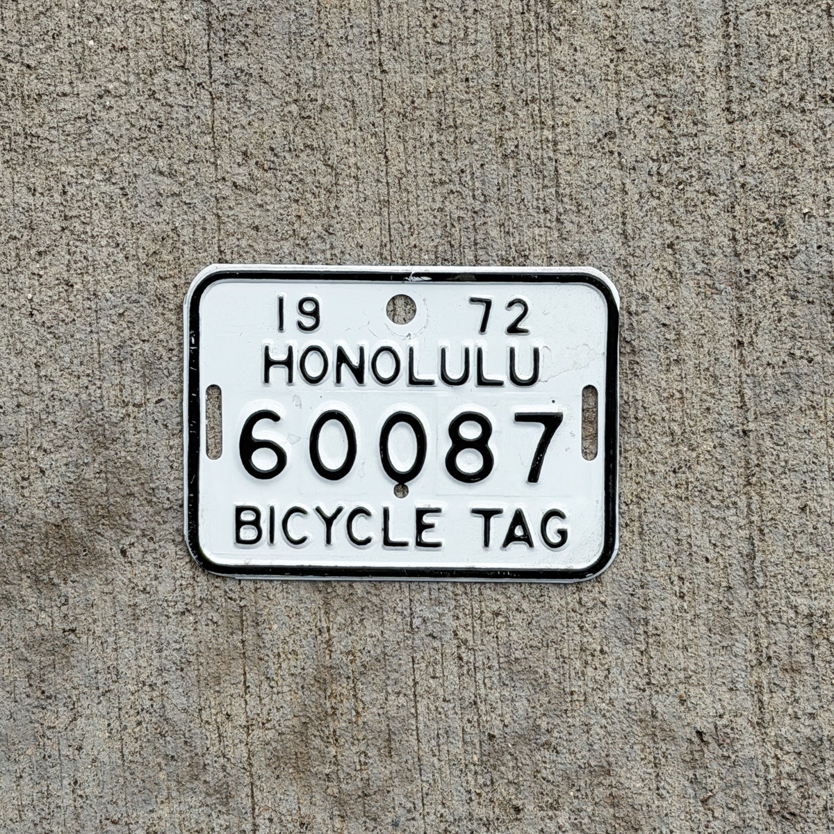 Photo of a 1972 Honolulu Hawaii Bicycle License Plate Auto Tag Garage Decor Vintage Bike 60087 with original patina