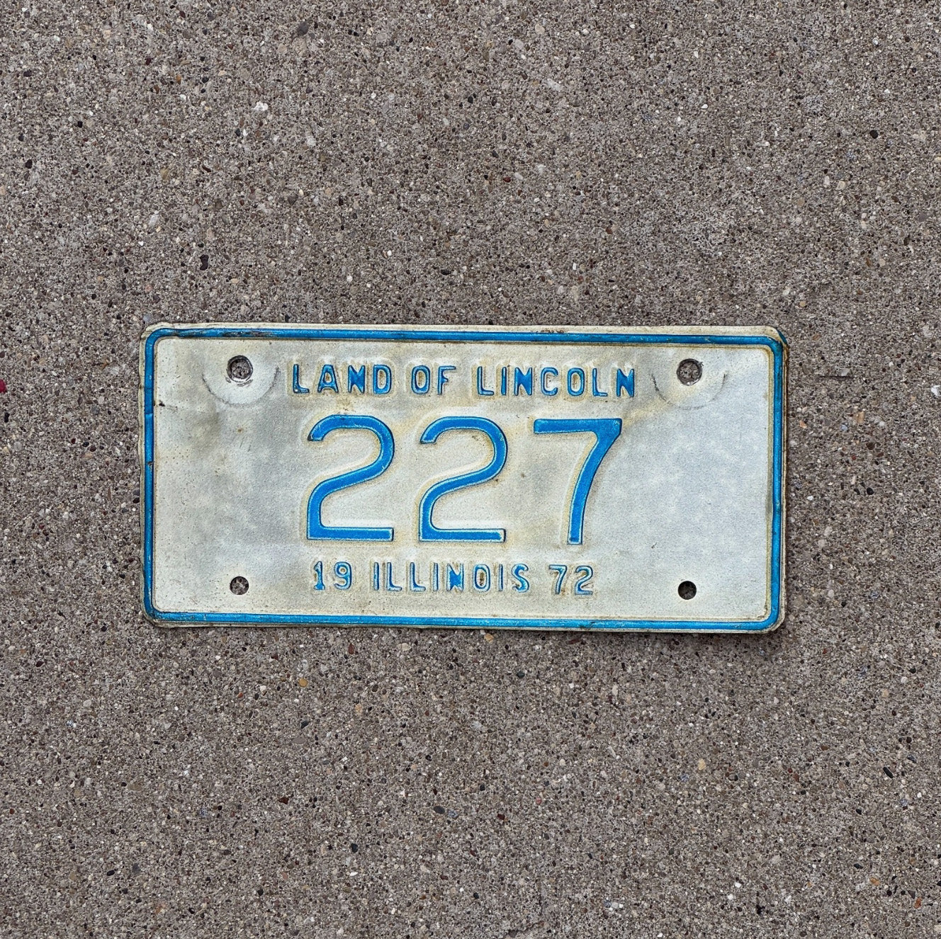 Photo of a 1972 Illinois Motorcycle License Plate Auto Tag Garage Decor Vintage Low Number Three Digit 227 with original patina