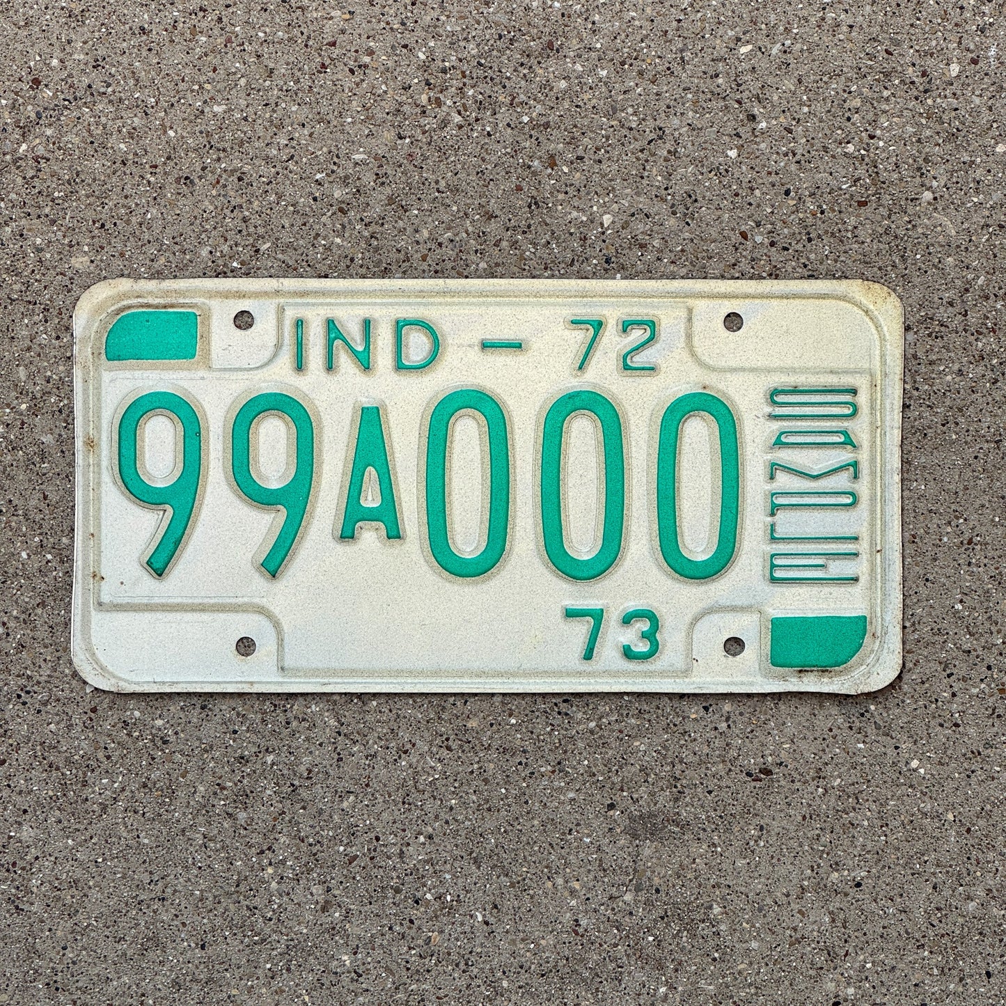 Photo of a 1972 Indiana Sample License Plate Auto Tag 3 Vintage 99A000 with original patina