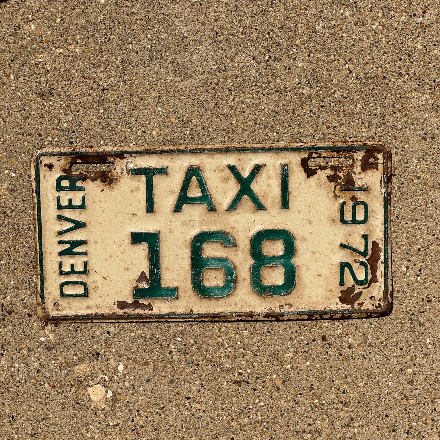 Photo of a 19722 Colorado Denver Taxi License Plate Auto Tag Garage Decor Vintage Cab 168