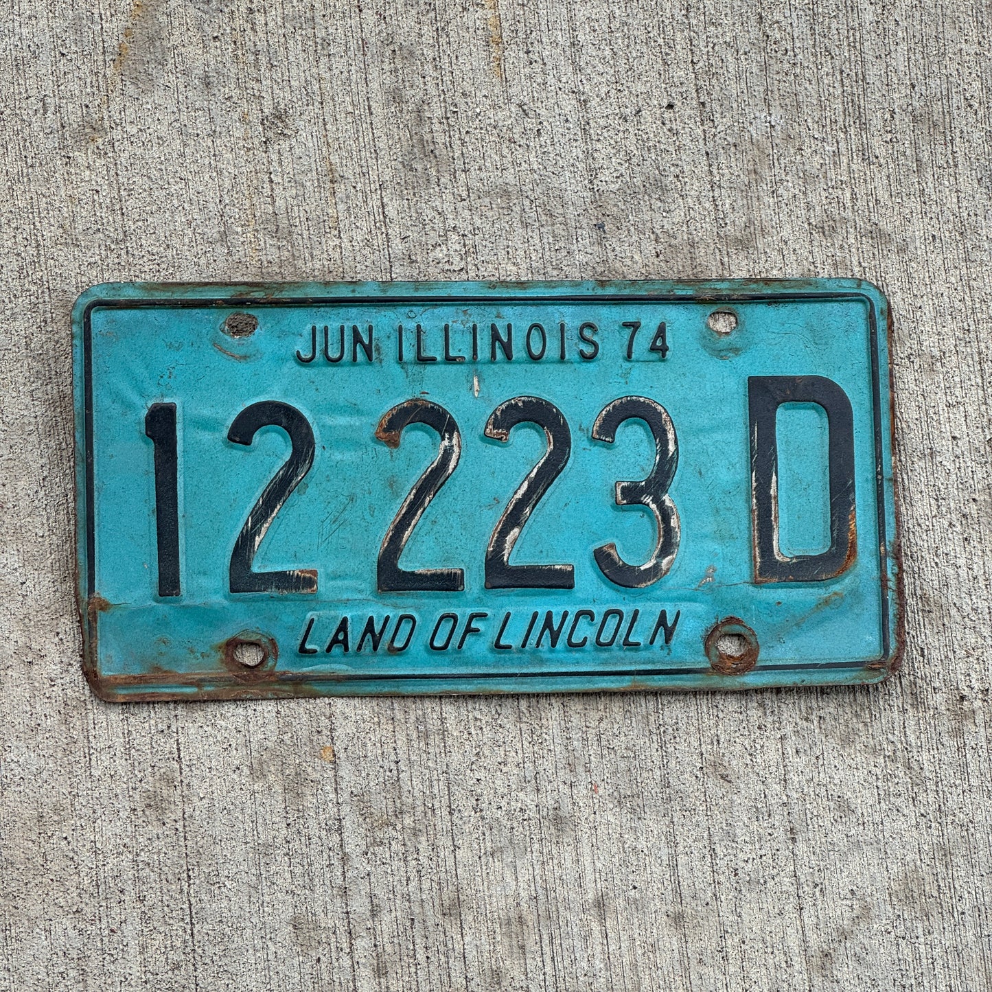 Photo of a 1973 1974 Illinois Truck License Plate Auto Tag Garage Decor Vintage Repeat Repeating 12 223 D with original patina