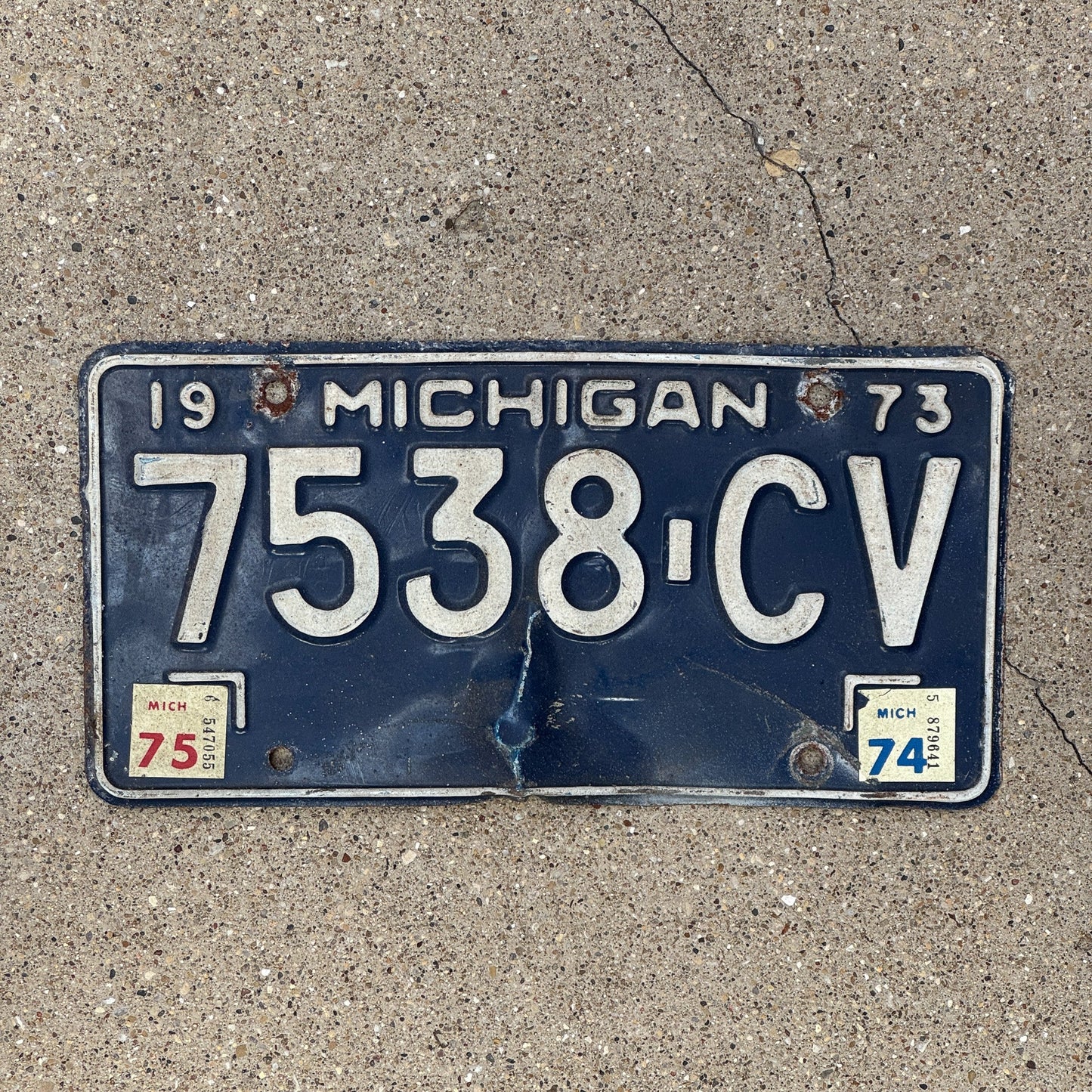 Photo of a 1973 1975 Michigan Commercial Truck License Plate Auto Tag Garage Decor Vintage 7538 CV