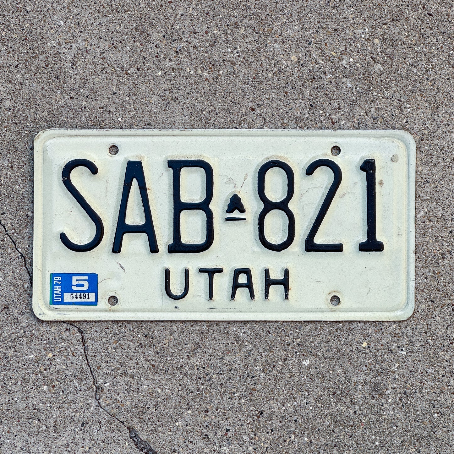 Photo of a 1973 1979 Utah License Plate Auto Tag Garage Decor Vintage SAB 821 with original patina
