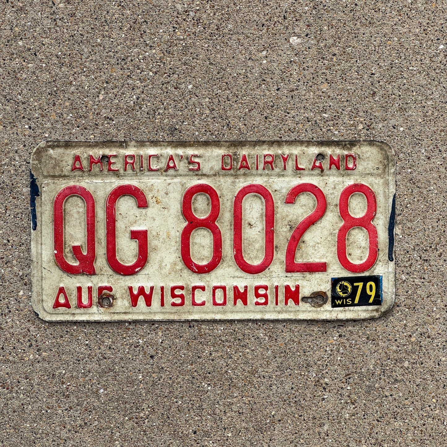 Photo of a 1973 1979 Wisconsin License Plate Auto Tag Garage Decor Vintage QG 8028 with original patina
