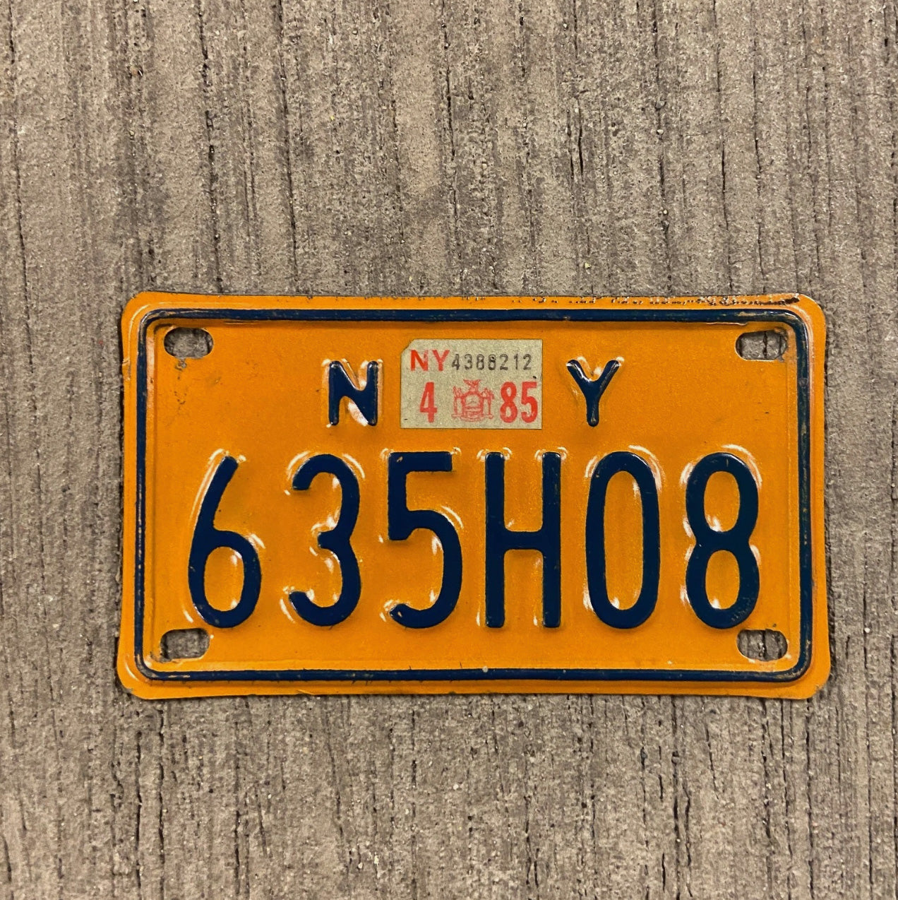 Photo of a 1973 1985 New York Motorcycle License Plate Auto Tag Garage Decor Vintage 635 H 08 with original patina