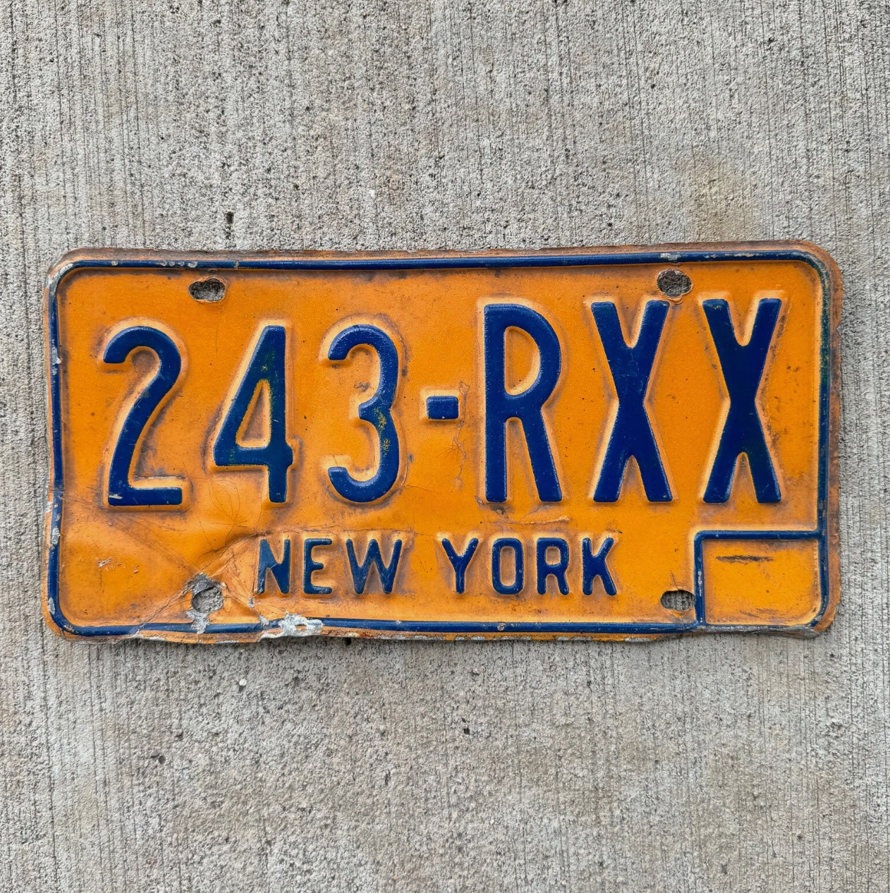 Photo of a 1973 1986 New York License Plate Auto Tag Garage Decor Vintage Orange 243 RXX