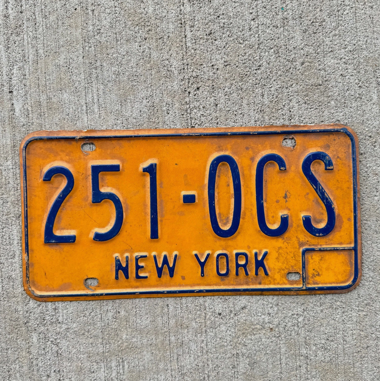 Photo of a 1973 1986 New York License Plate Auto Tag Garage Decor Vintage Orange 251 OCS