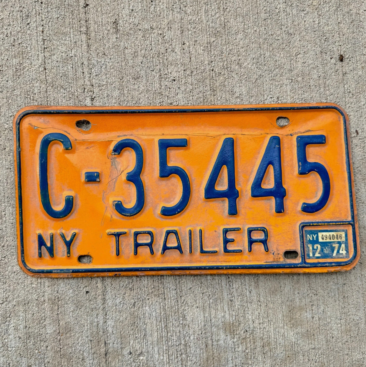 Photo of a 1973 1986 New York Trailer License Plate Auto Tag Garage Decor Vintage Orange C 35445